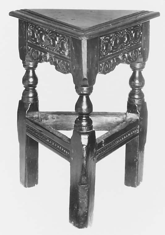 Triangular carved oak stool