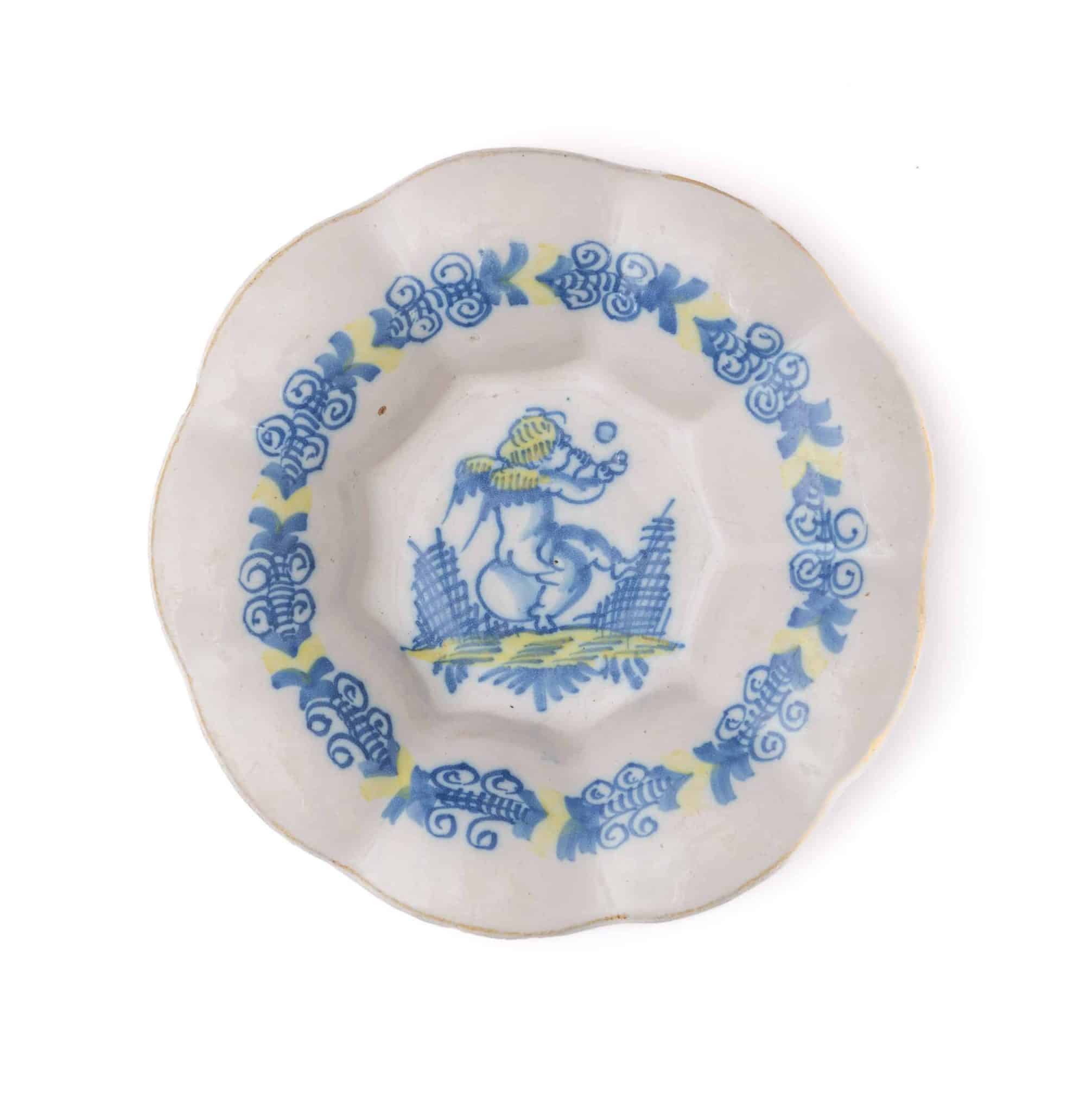 Small Delftware Dish Depicting a Putto with Ball