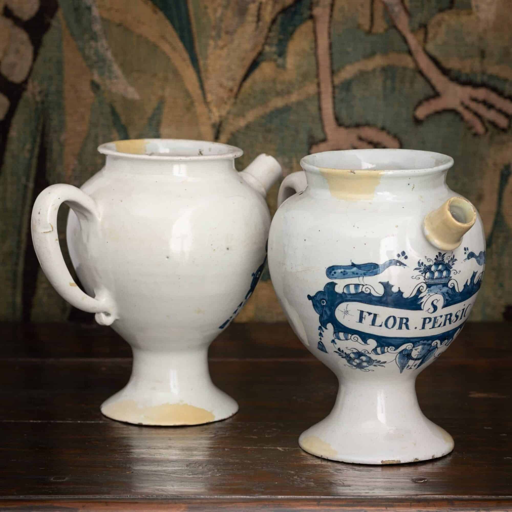 Pair of English delftware syrup jars (albarelli with spouts)