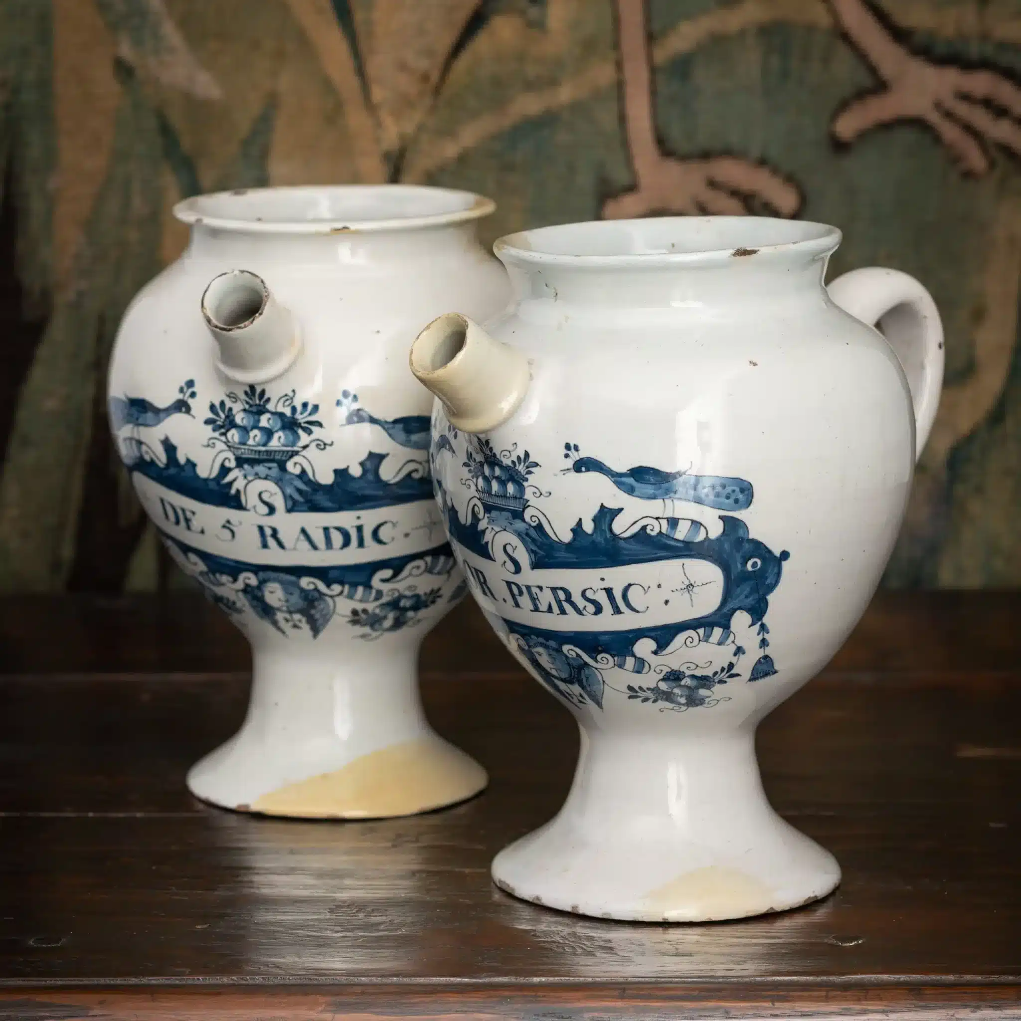 Pair of English delftware syrup jars (albarelli with spouts)