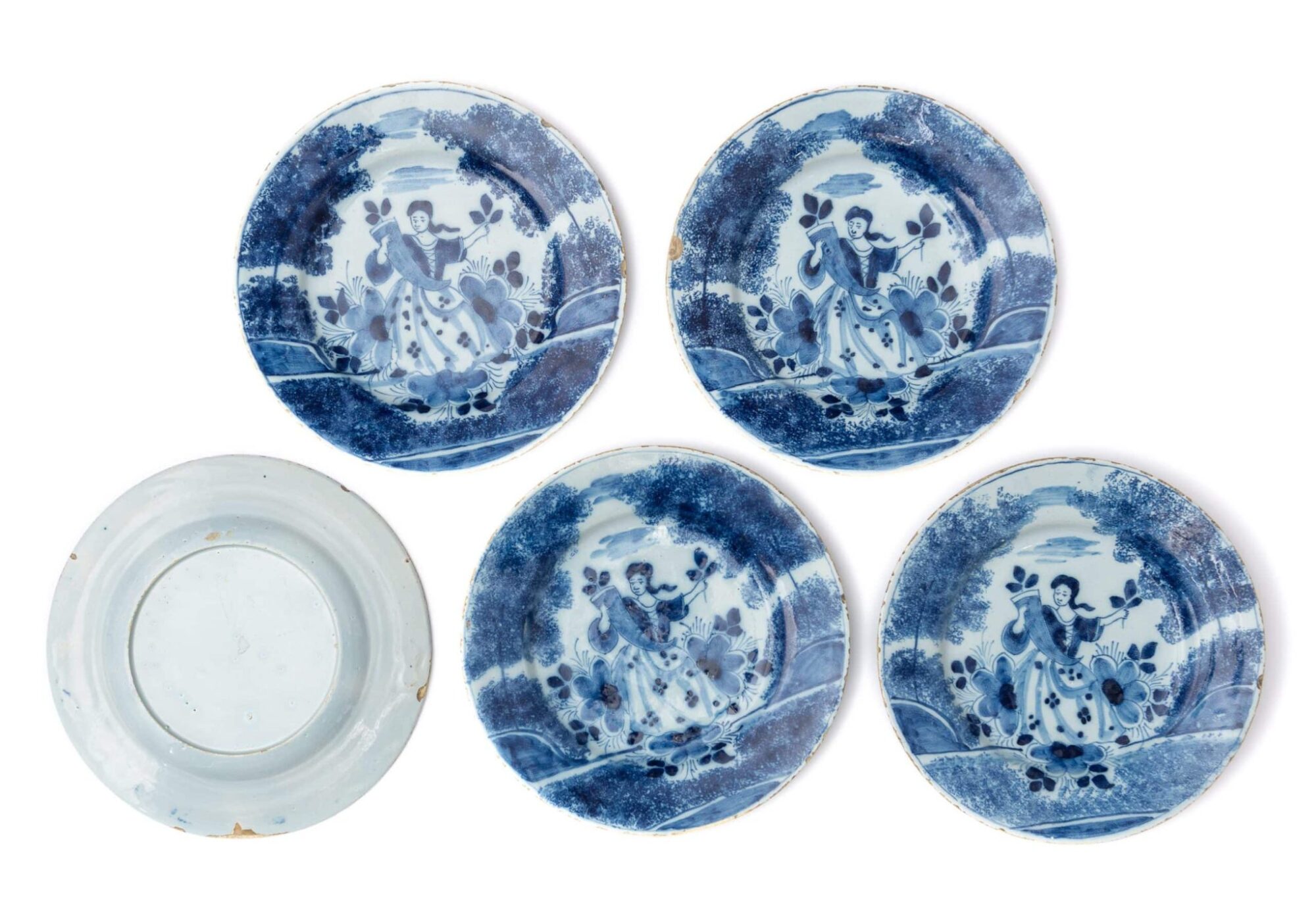 Set of Five English Delftware Plates Painted with a Lady in a Landscape