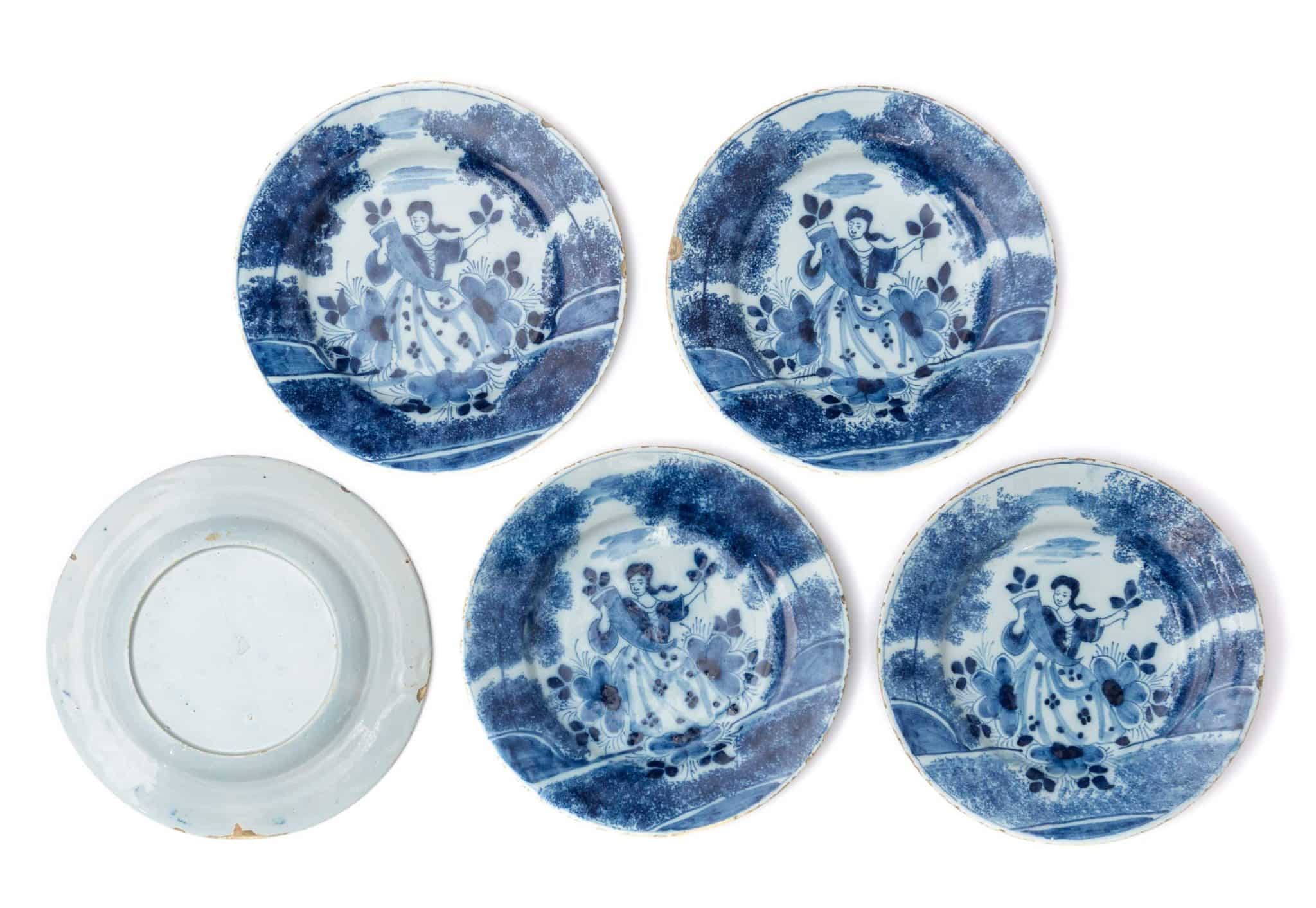 Set of Five English Delftware Plates Painted with a Lady in a Landscape