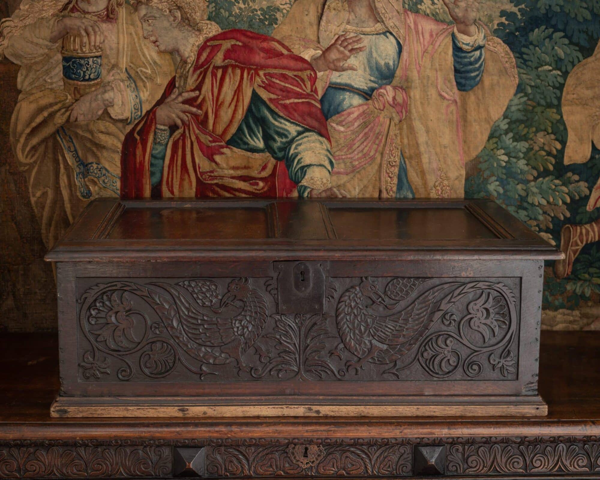Large Carved Oak Box with Panelled Lid, the Front with Addorsed Birds and Vinework