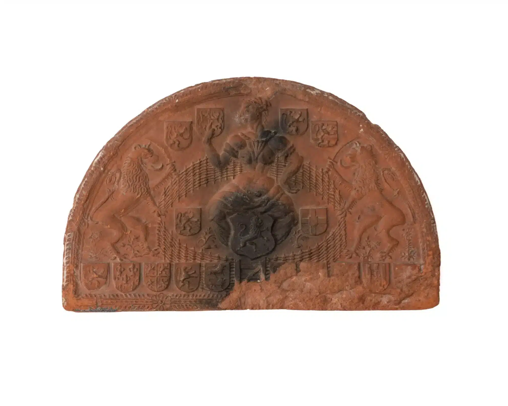 A Large Netherlandish Relief-Moulded Terracotta Armorial Tile (Hearth Tympanum)