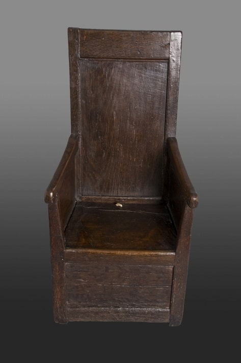 Henry VIII oak enclosed armchair