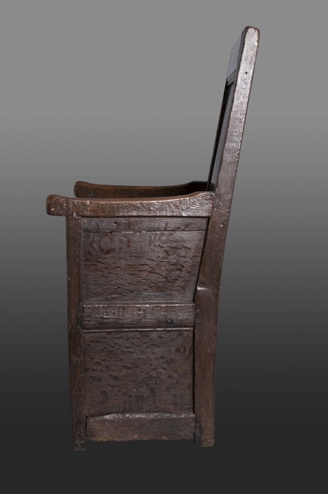 Henry VIII oak enclosed armchair