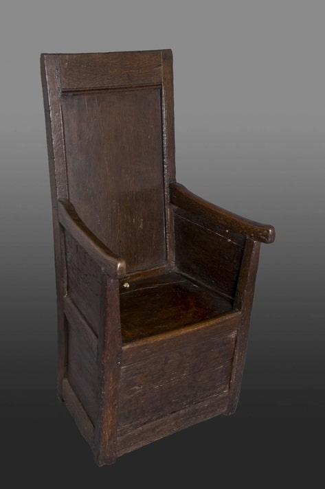 Henry VIII oak enclosed armchair