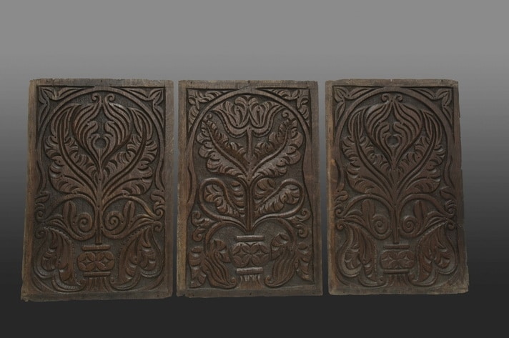Panels carved with Dennis-like botanical motifs
