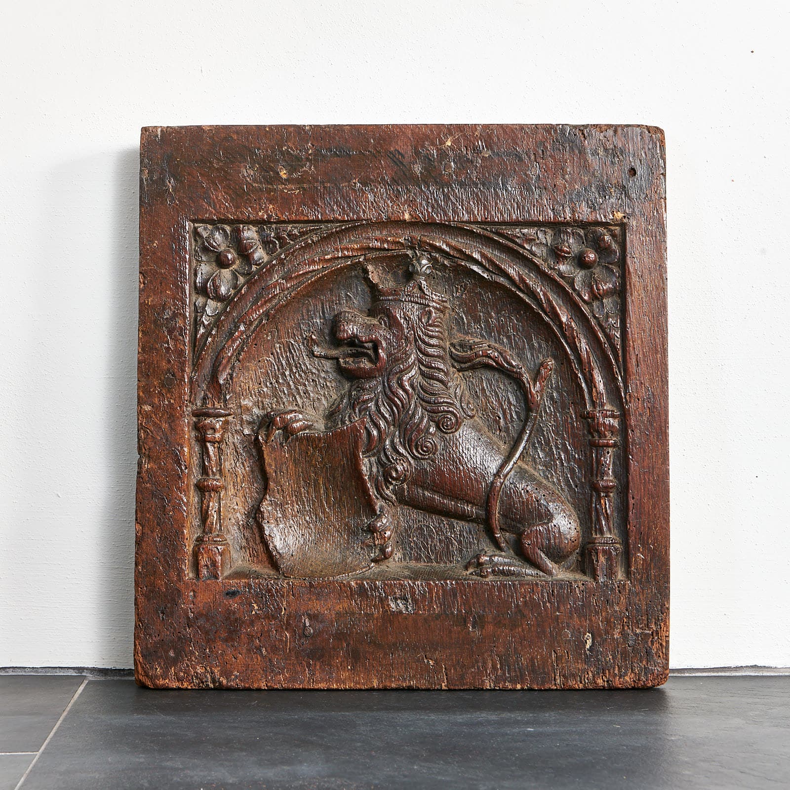 Heraldic lion carved panel