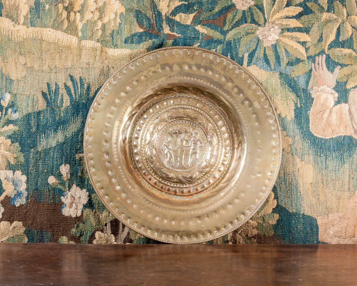 Large Adam and Eve brass alms dish