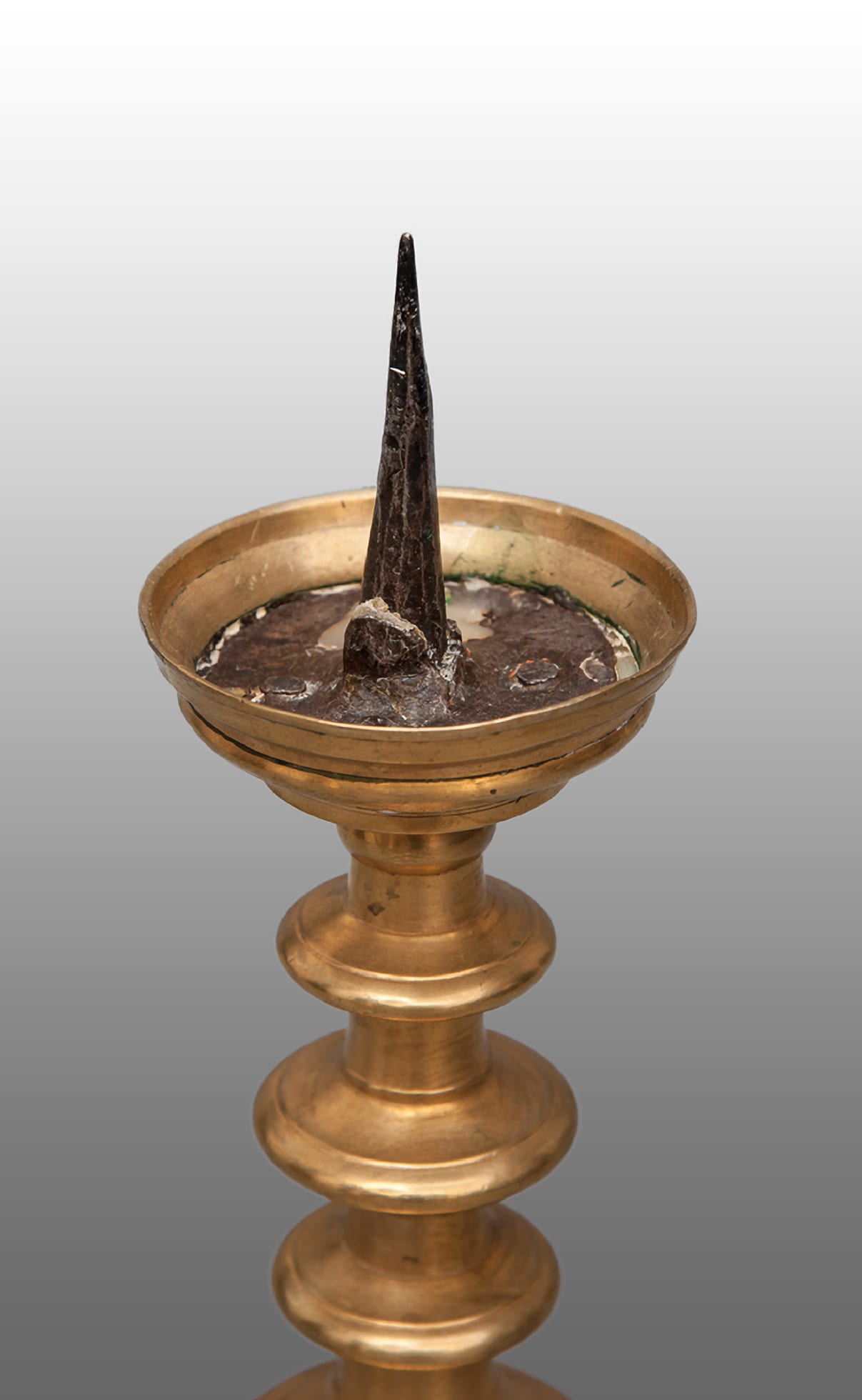 Pair of 16th century brass pricket candlesticks