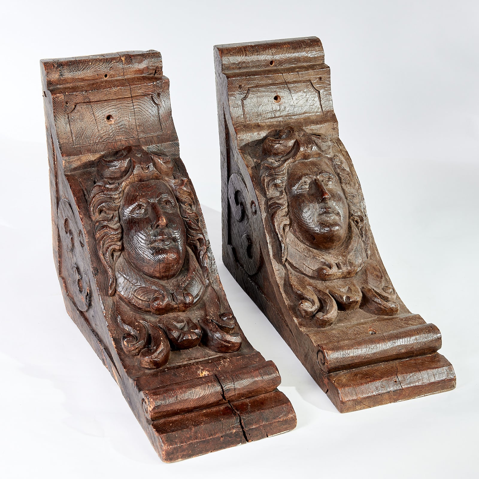 Late 16th century carved oak brackets