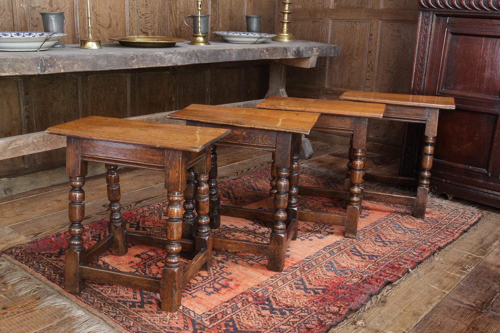 Set of four Charles I oak stools
