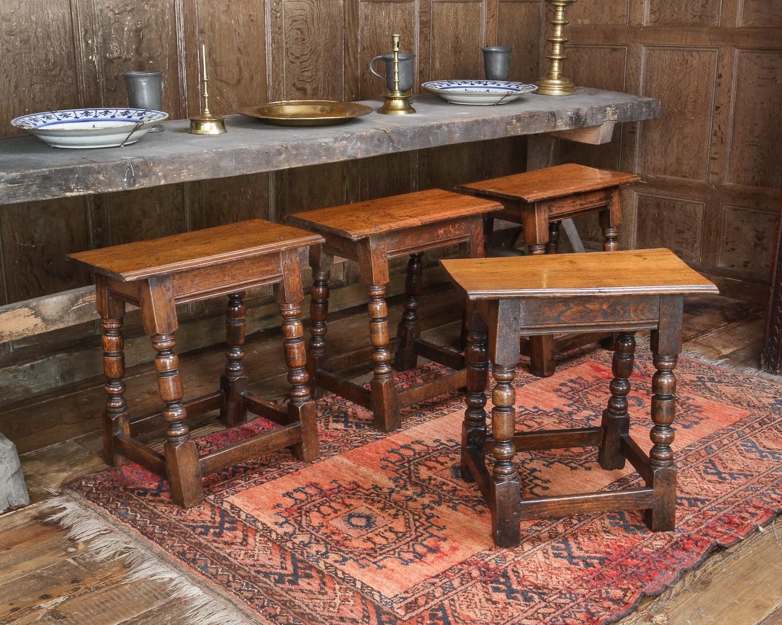 Set of four Charles I oak stools
