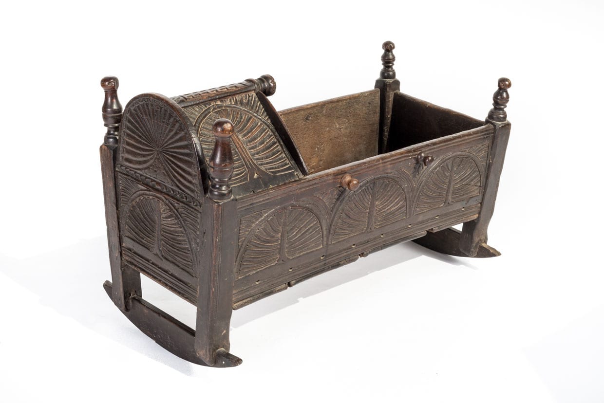 17th century carved oak cradle