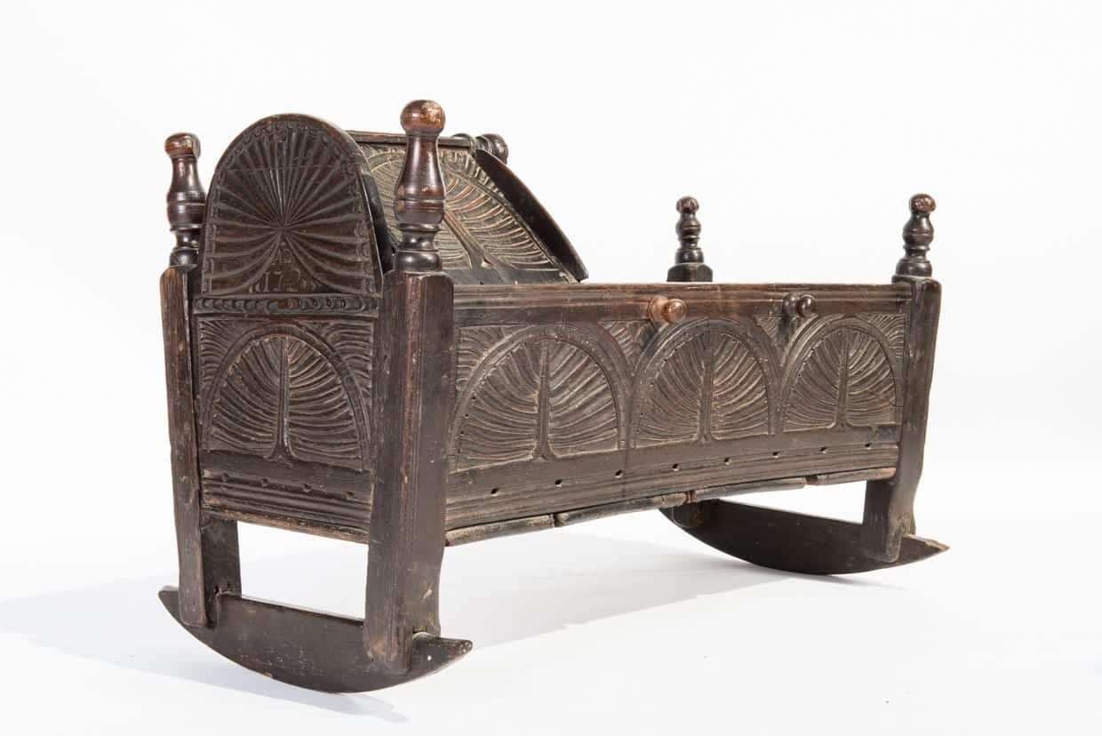 17th century carved oak cradle