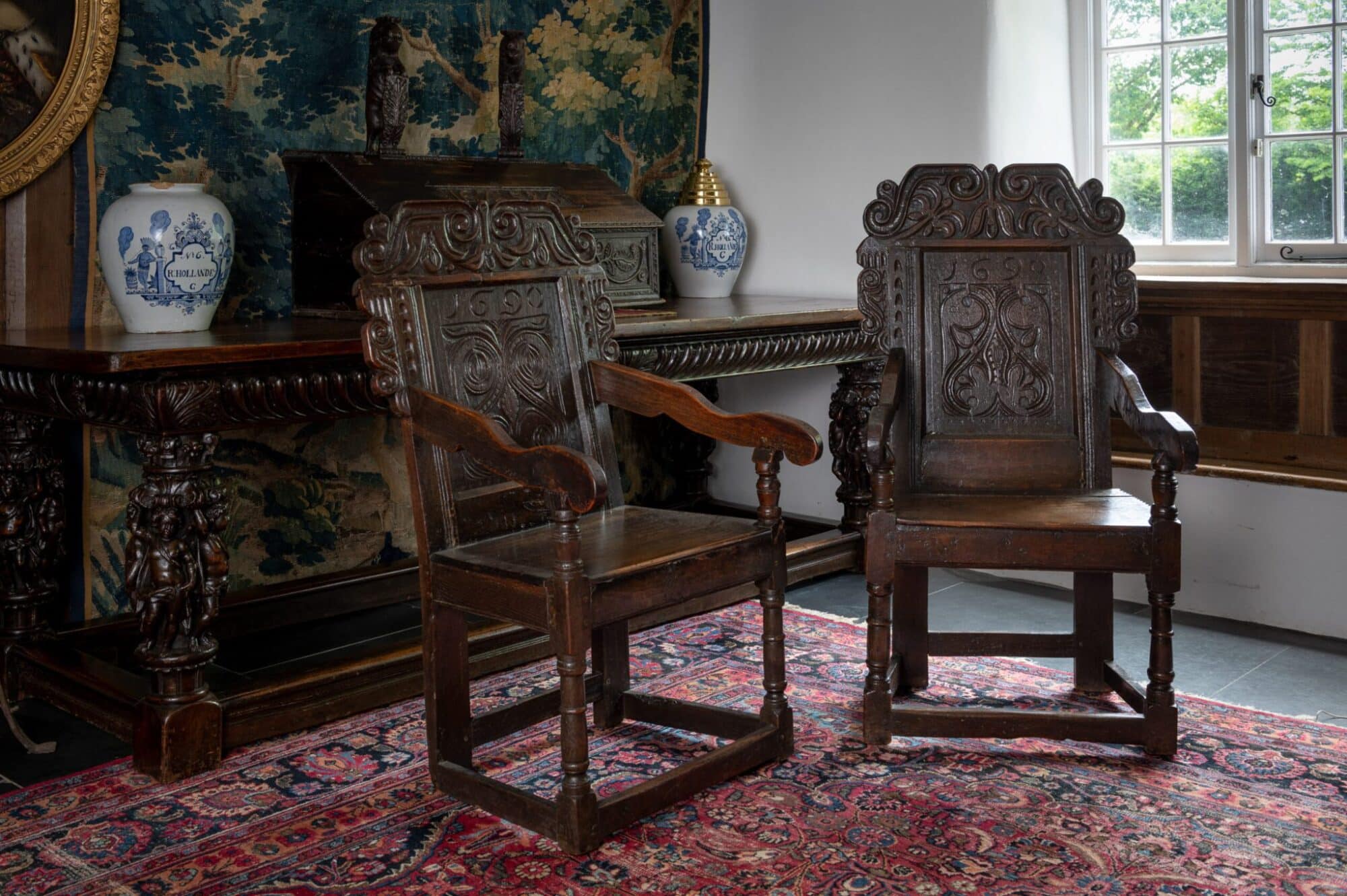 James II pair of joined oak armchairs