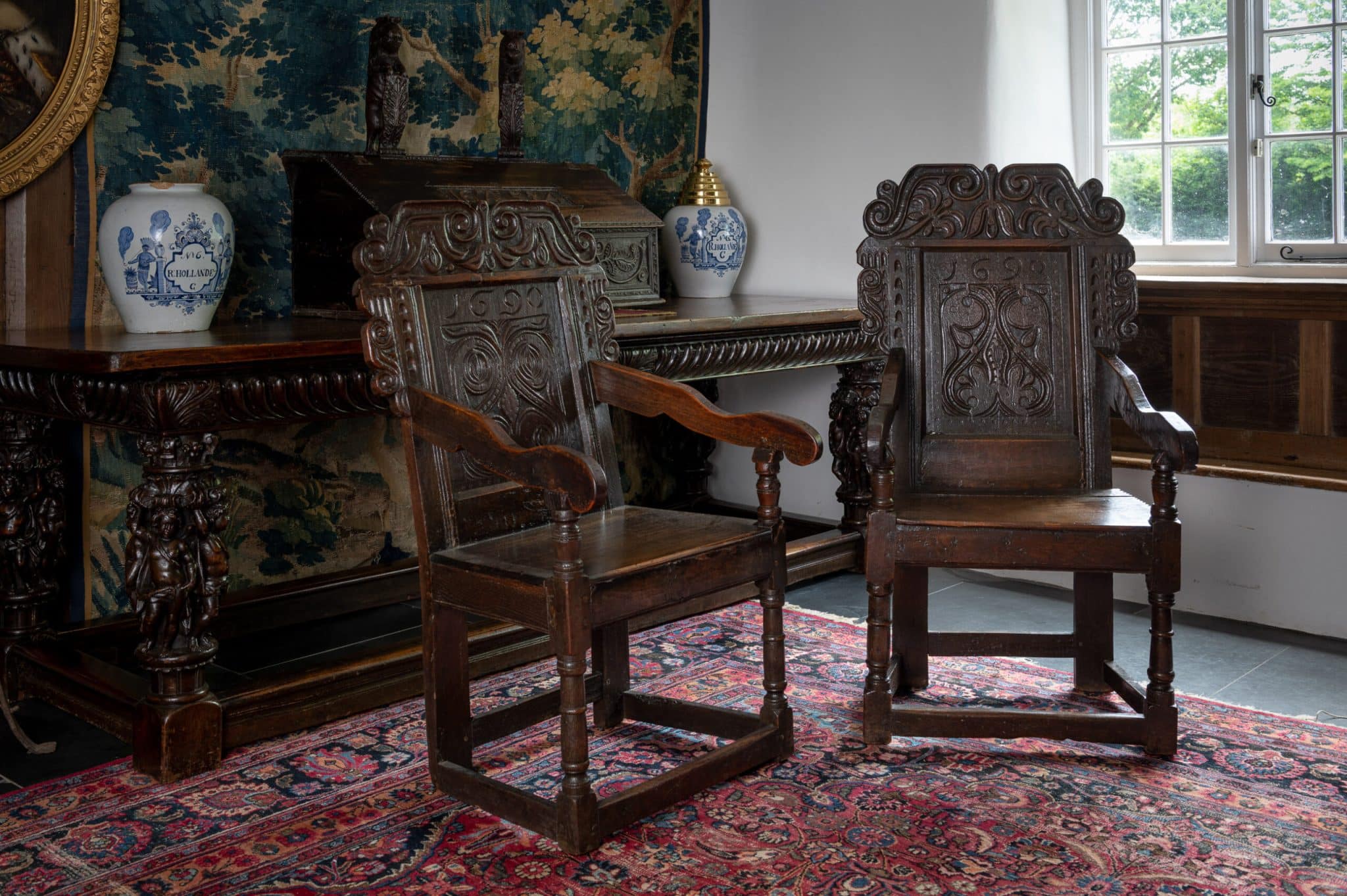 James II pair of joined oak armchairs