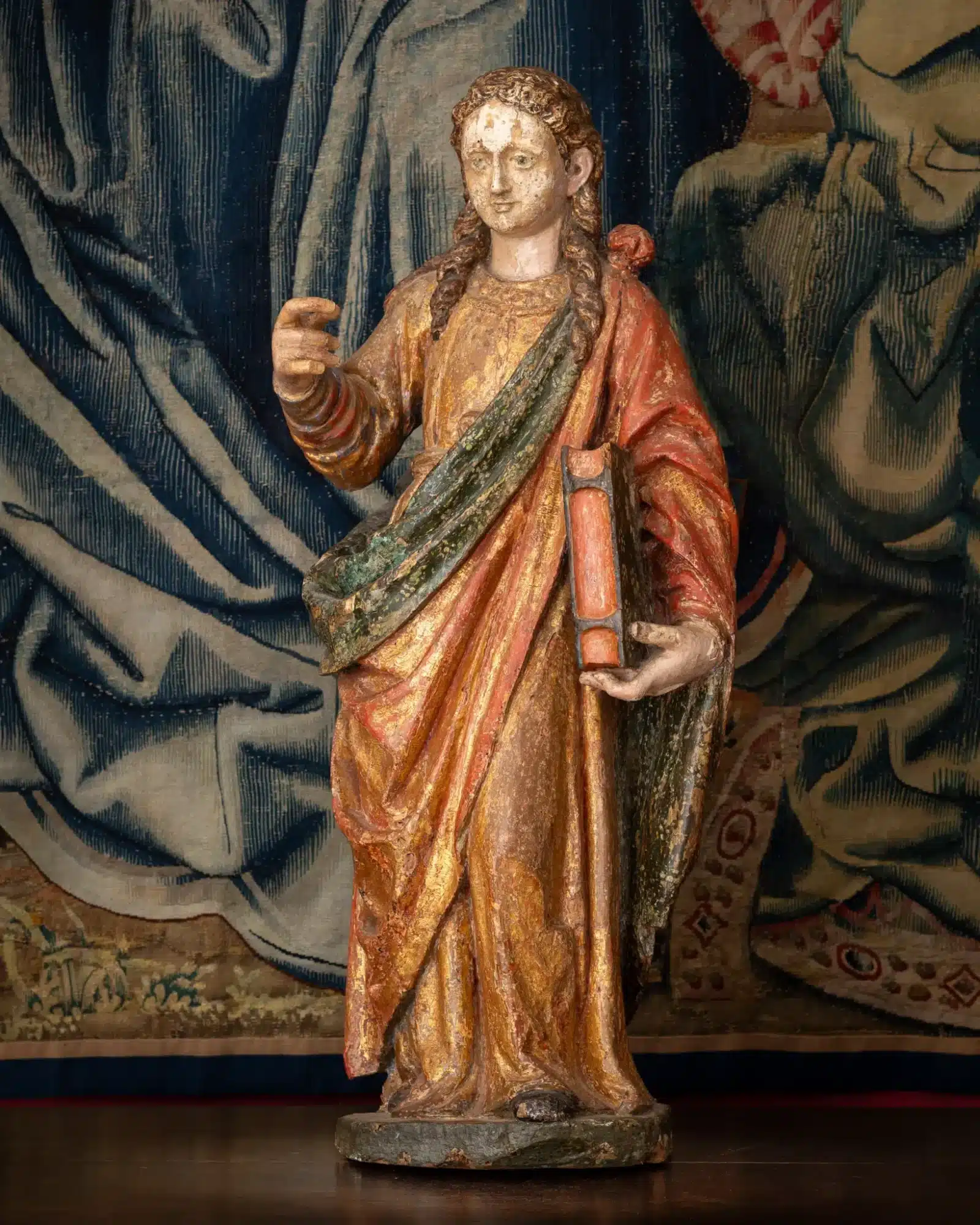 A Polychrome Sculpture of a Female Saint