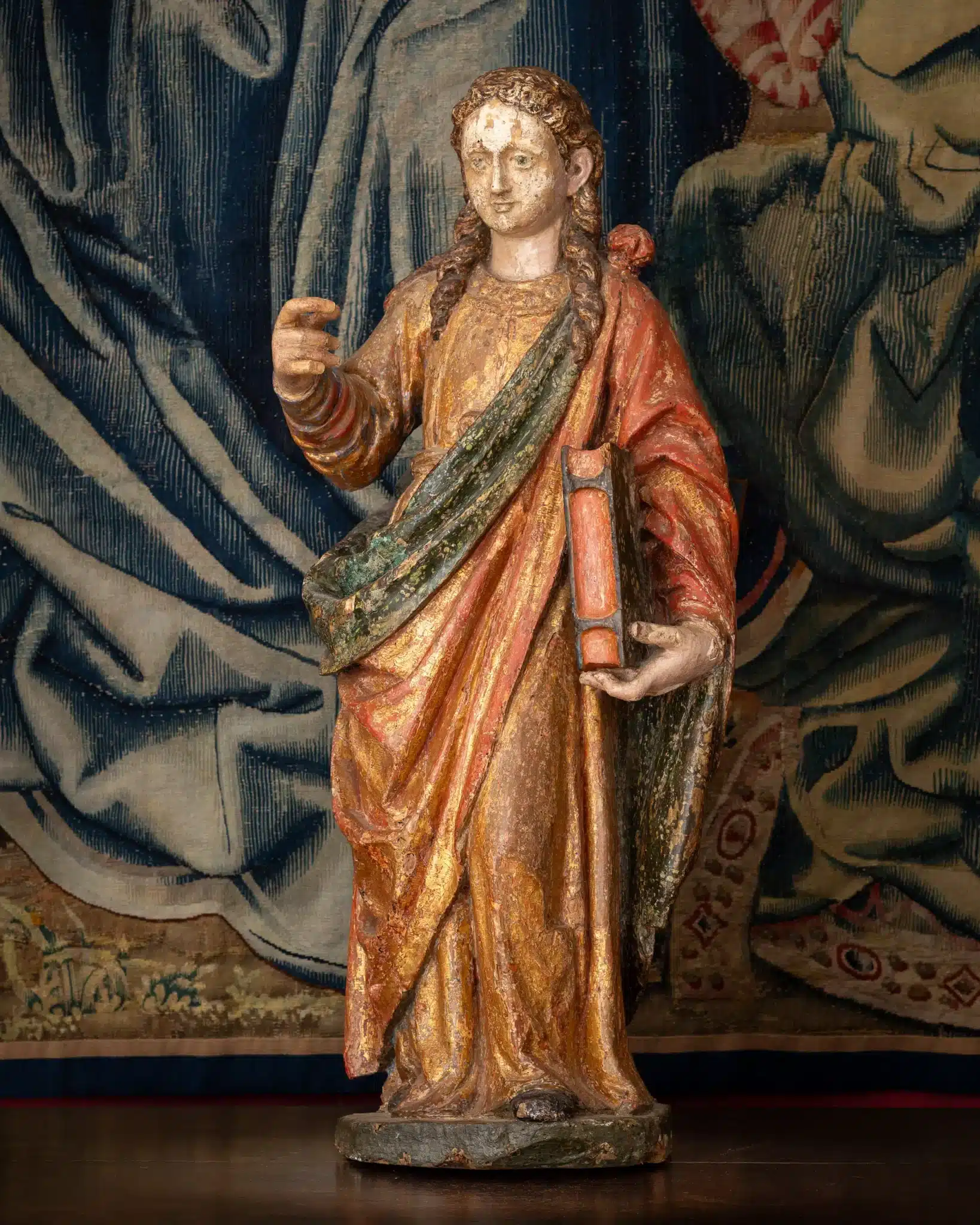 A Polychrome Sculpture of a Female Saint