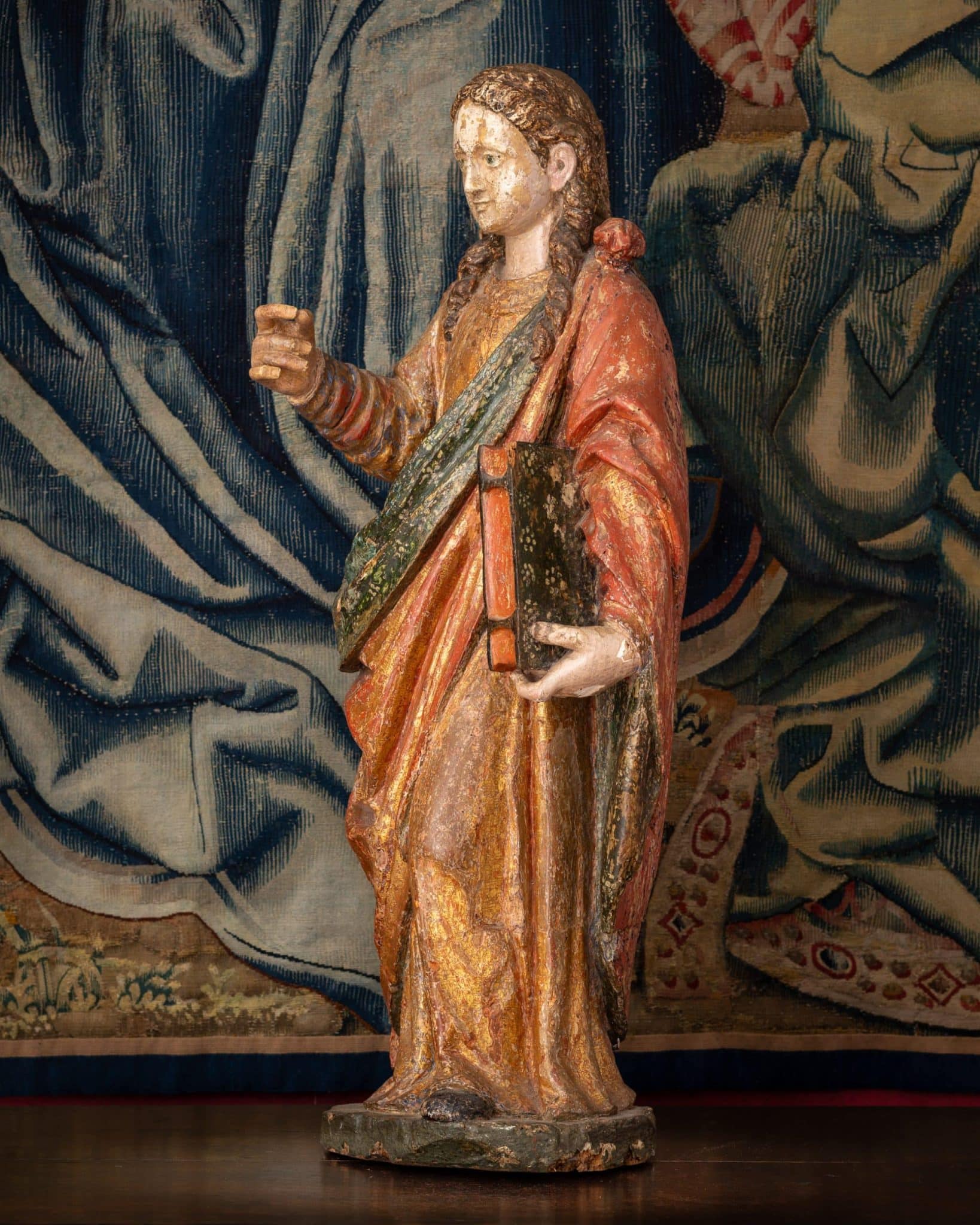 A Polychrome Sculpture of a Female Saint
