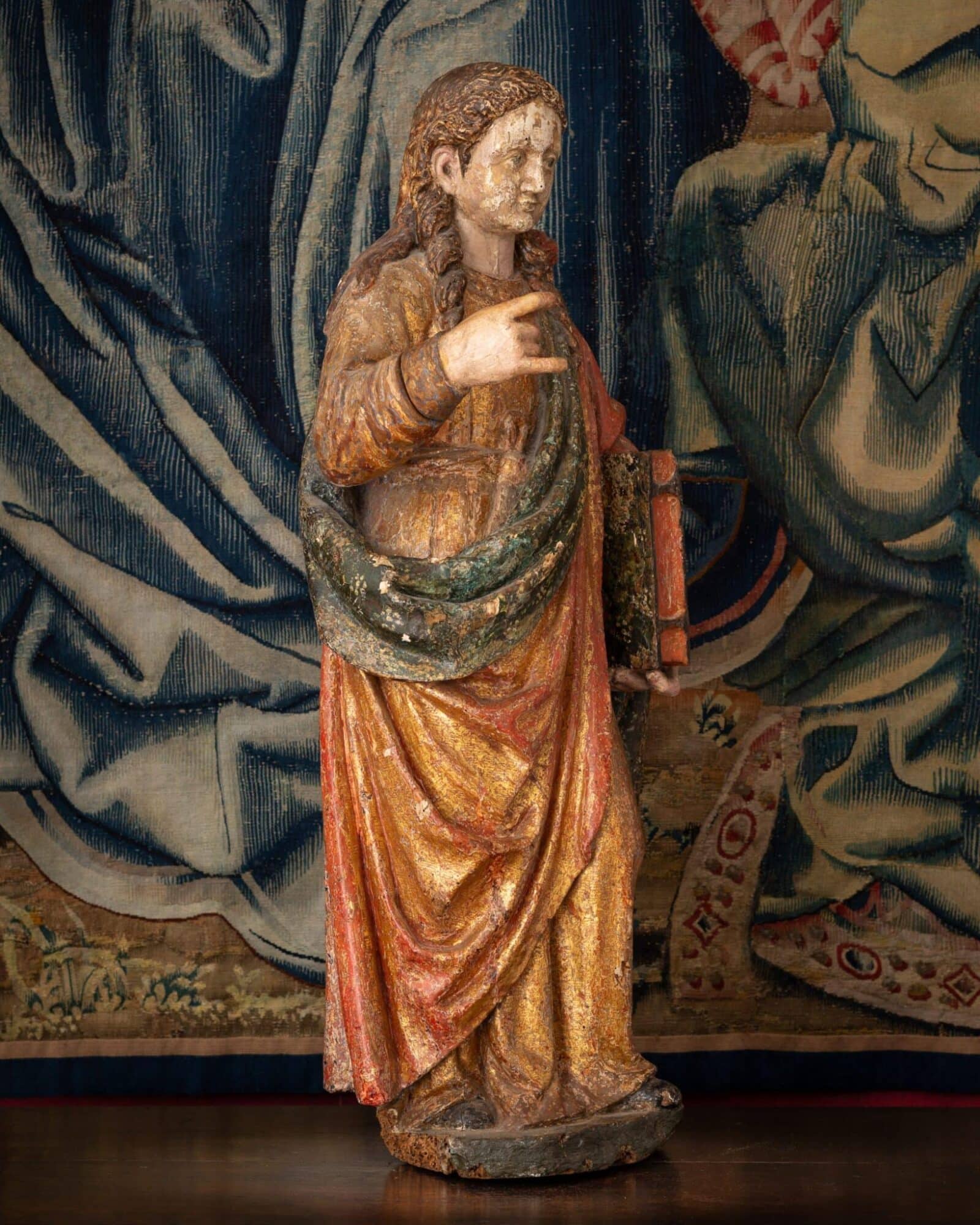 A Polychrome Sculpture of a Female Saint