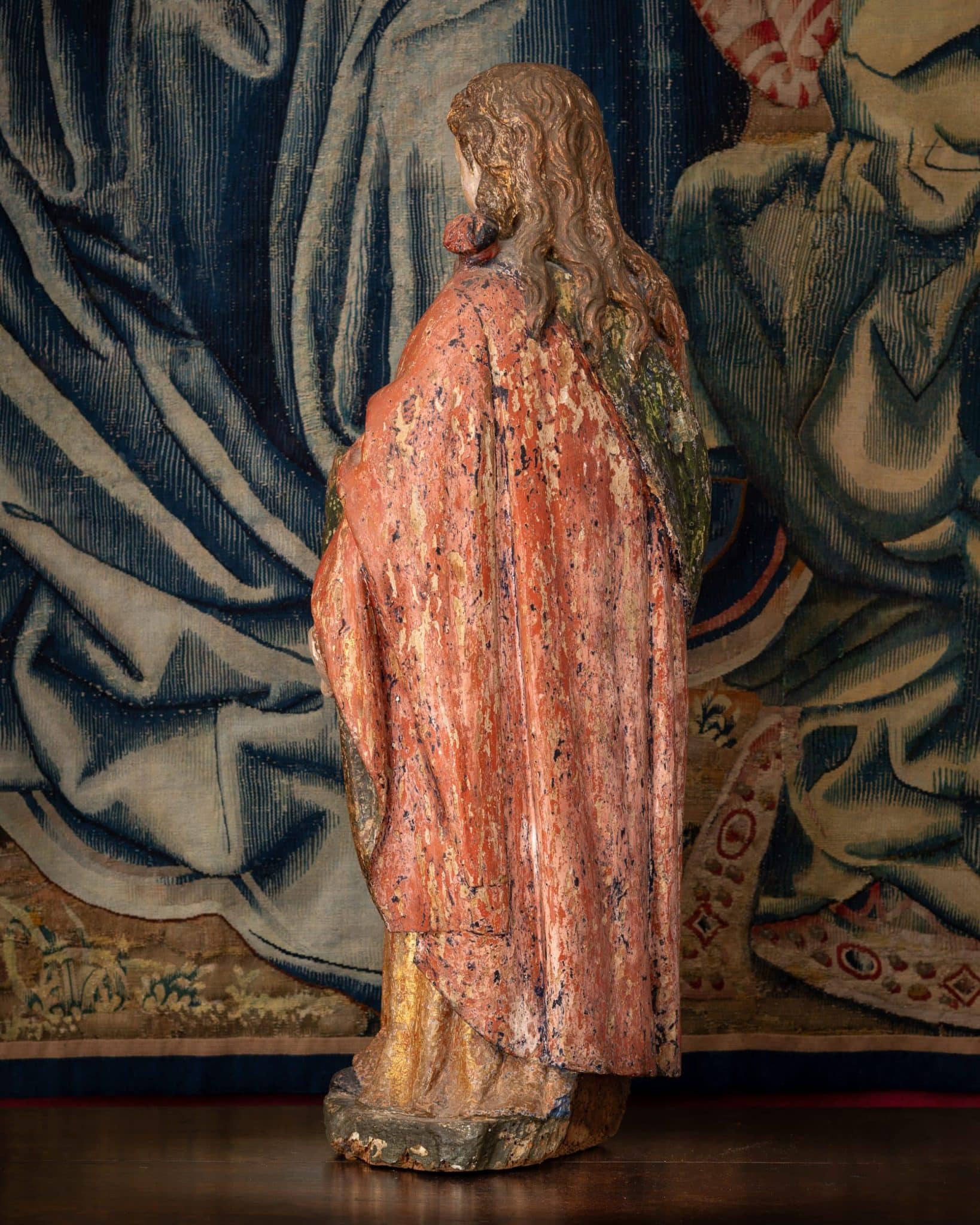 A Polychrome Sculpture of a Female Saint