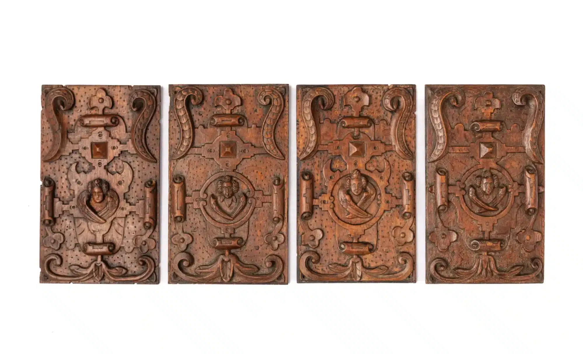 Set of Four Carved Oak Panels with Winged Angels