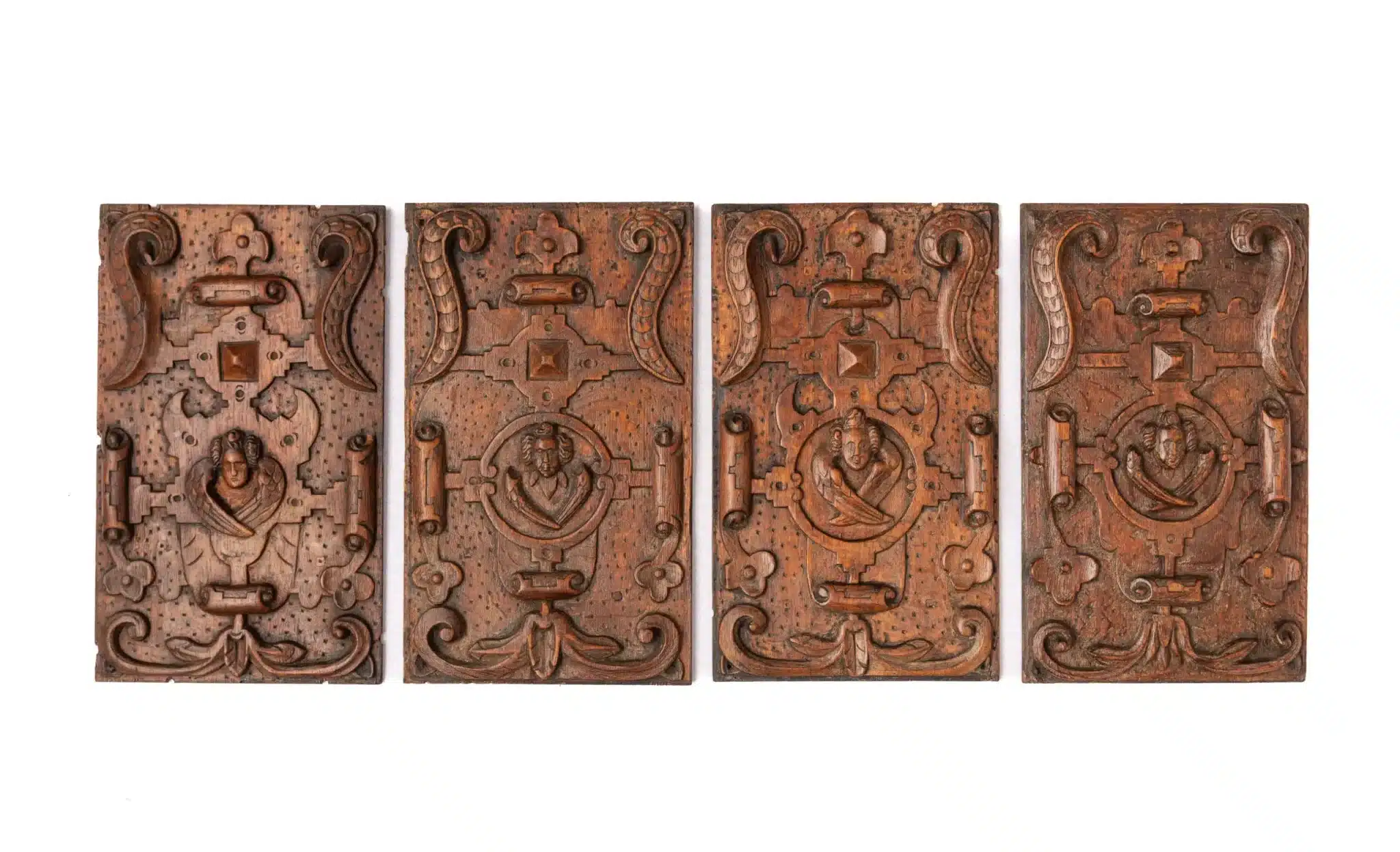 Set of Four Carved Oak Panels with Winged Angels