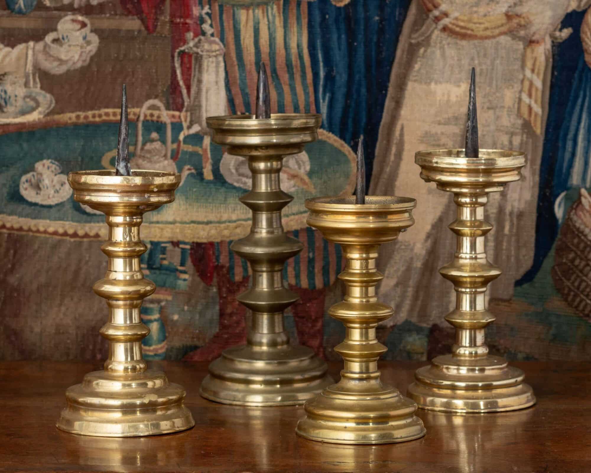 Group of Four Renaissance Brass Pricket Candlesticks