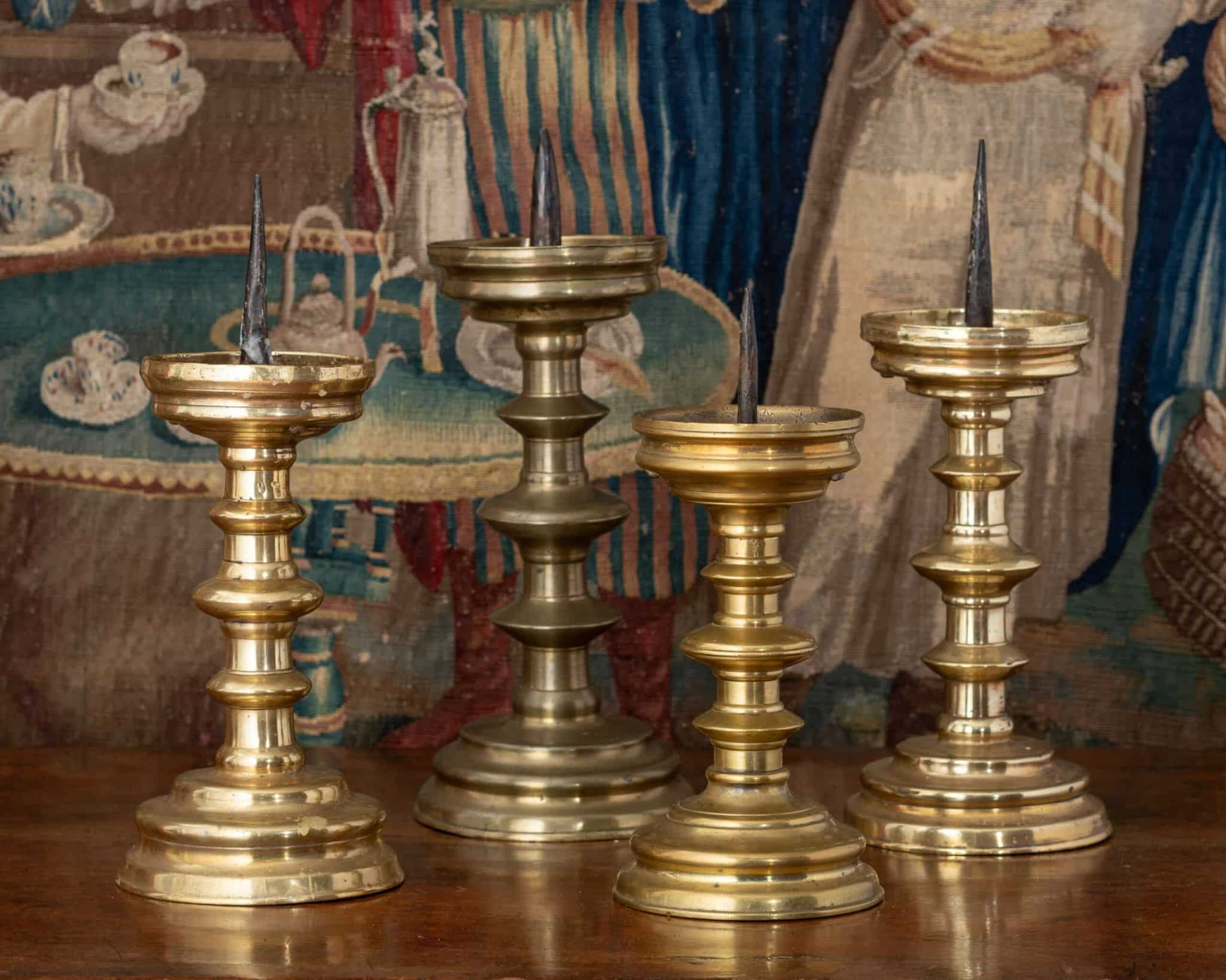 Group of Four Renaissance Brass Pricket Candlesticks