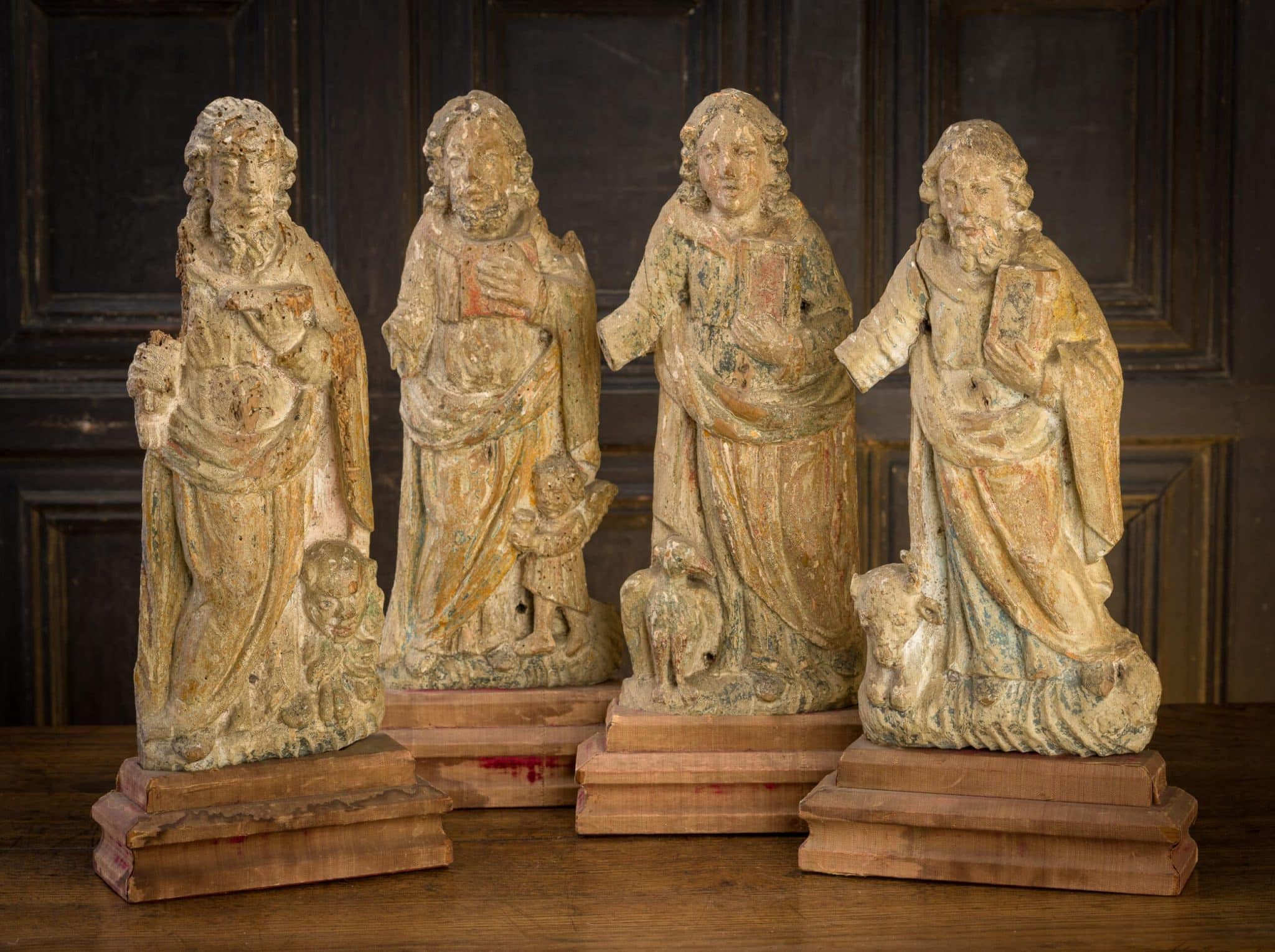 Set of Four Late Gothic Flemish Sculptures of Evangelists and St. Michael