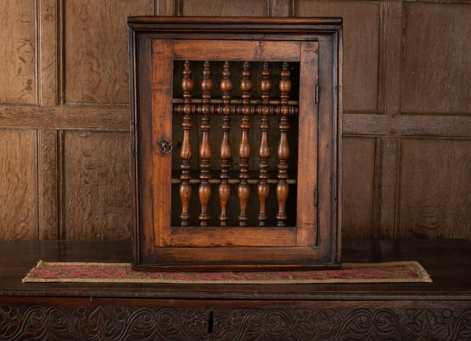 Mural spindle livery cupboard
