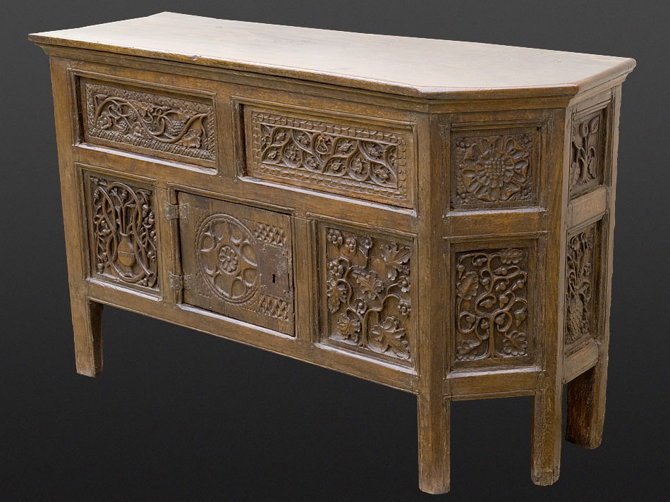 Henry VIII carved oak canted cupboard