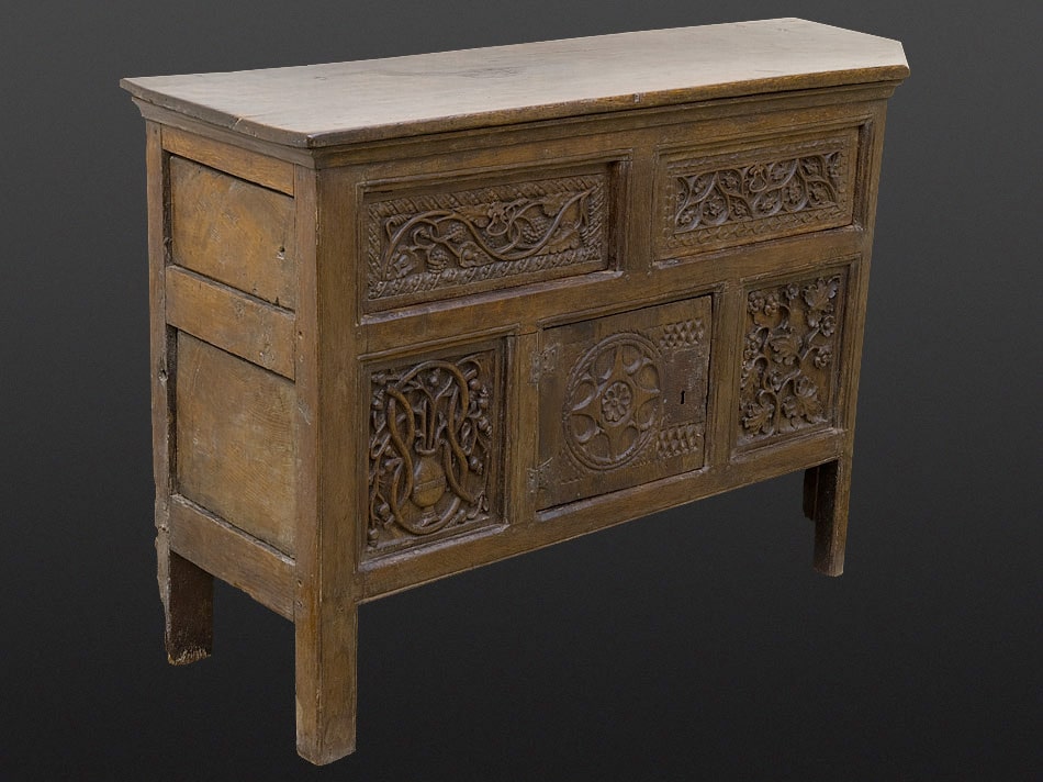 Henry VIII carved oak canted cupboard