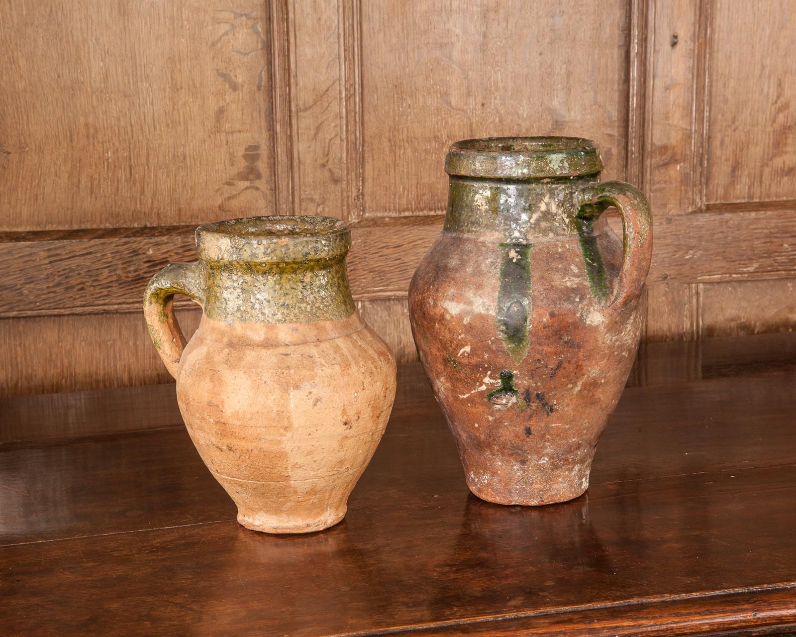 Two Medieval green glazed mugs