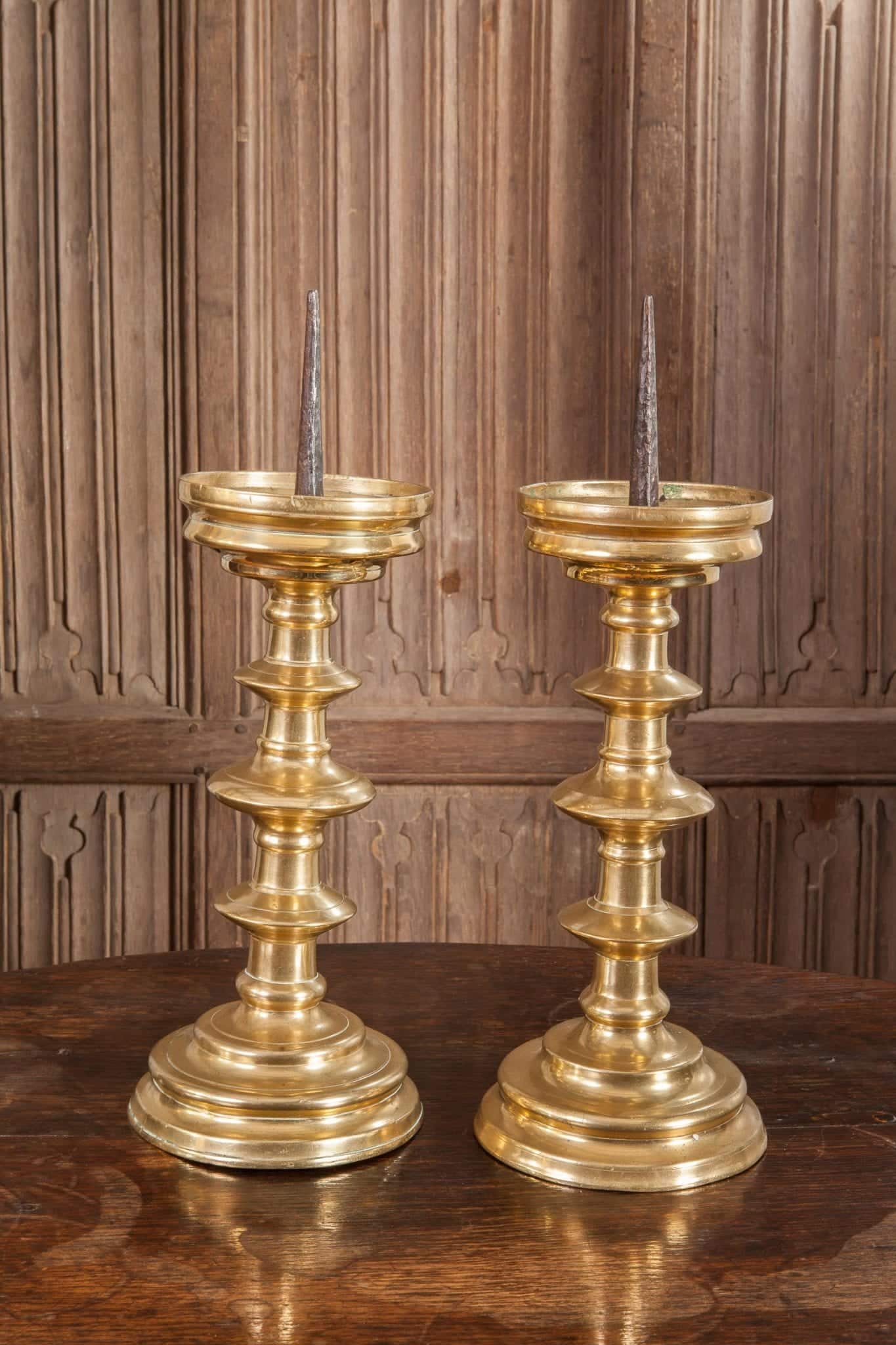 Pair of 16th century brass candlesticks