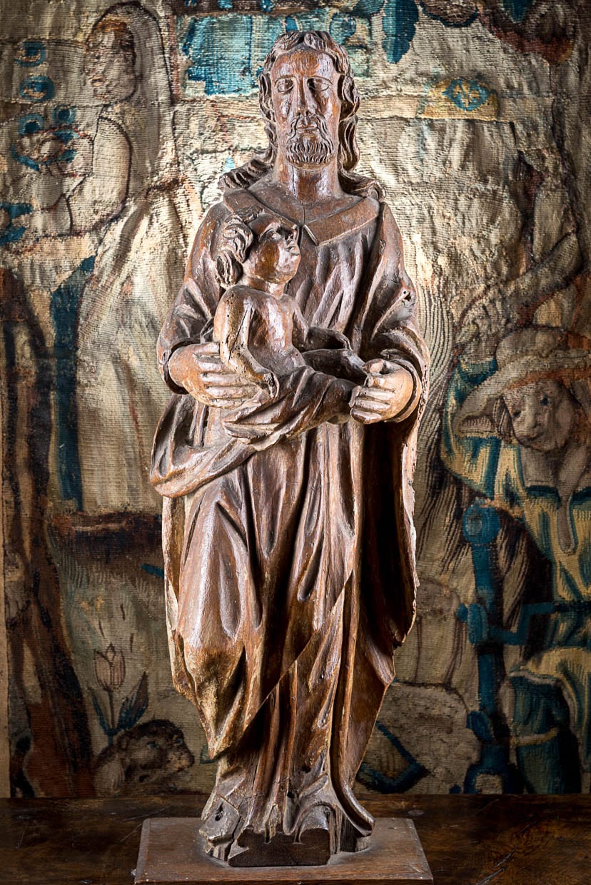 Sculpture of St Anthony holding Jesus