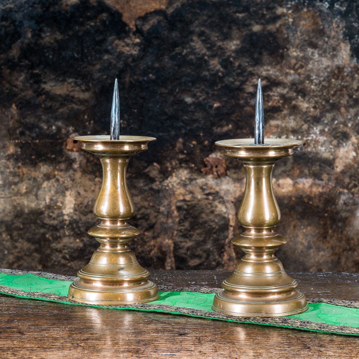 Late 16th century pair of pricket candlesticks