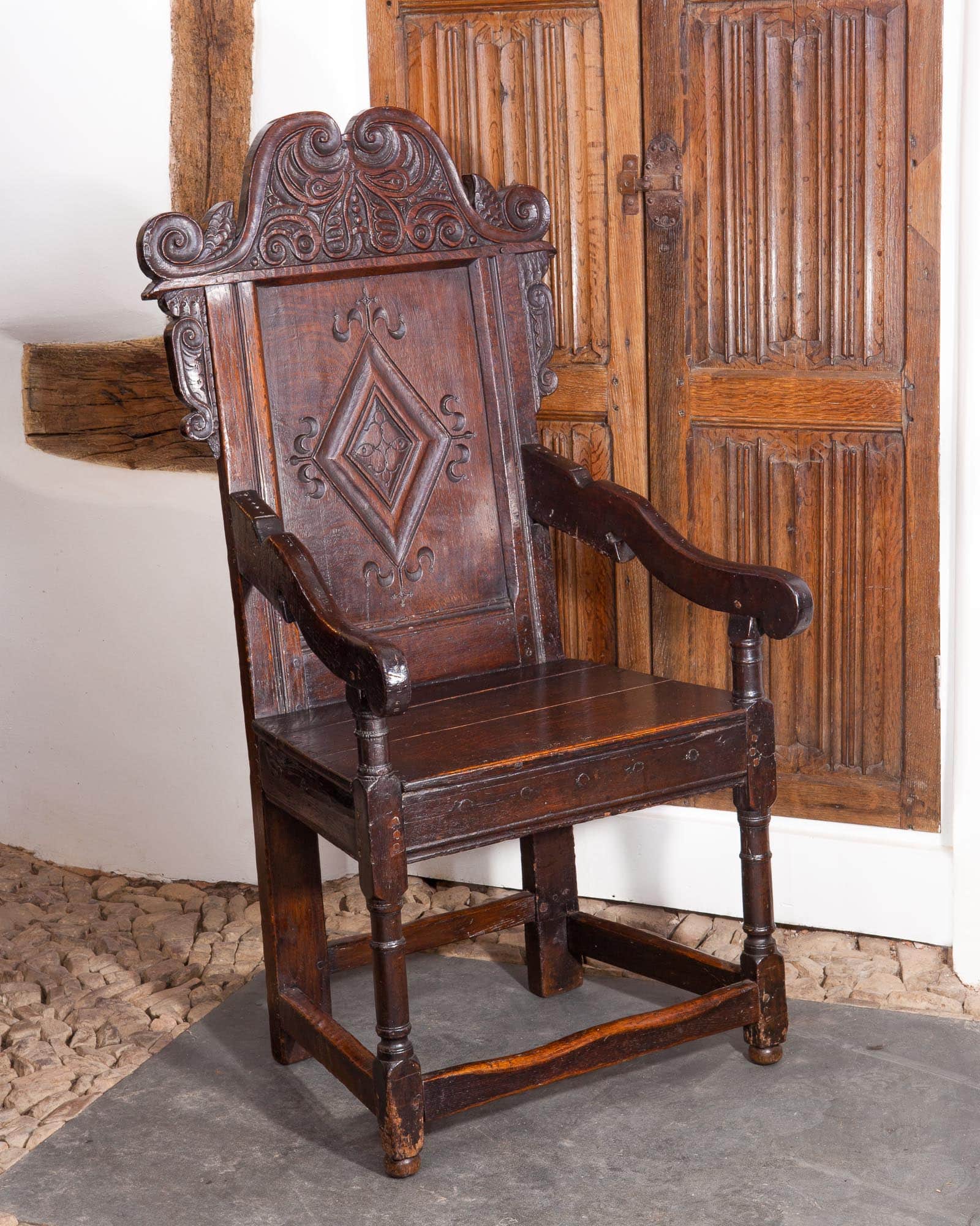 Charles II carved oak armchair