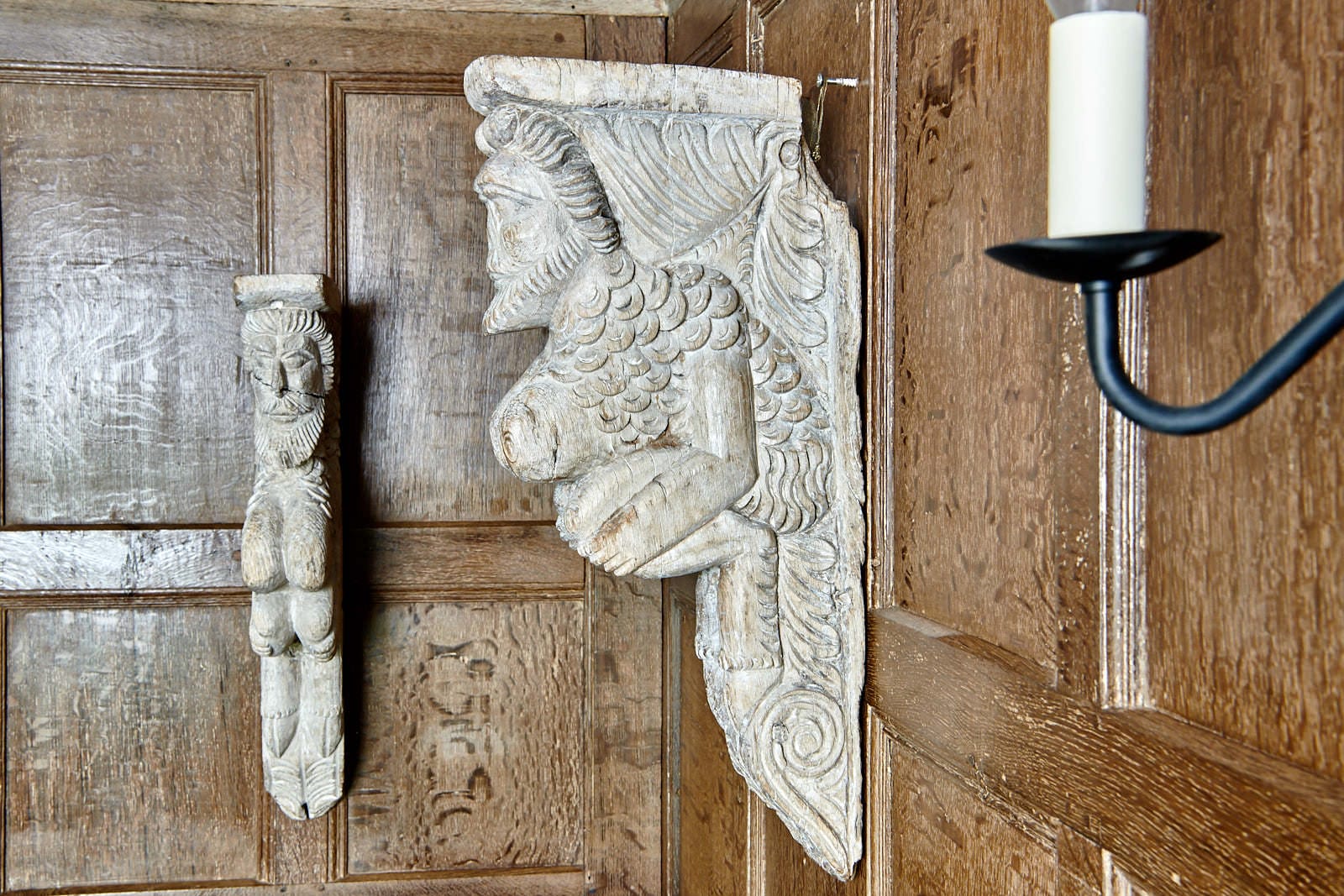 Pair of Elizabeth I oak Satyrs
