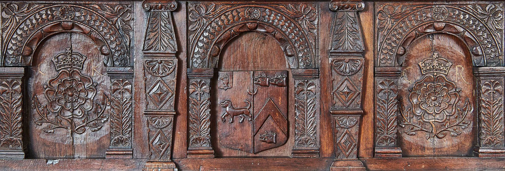 Charles I oak carved heraldic overmantel