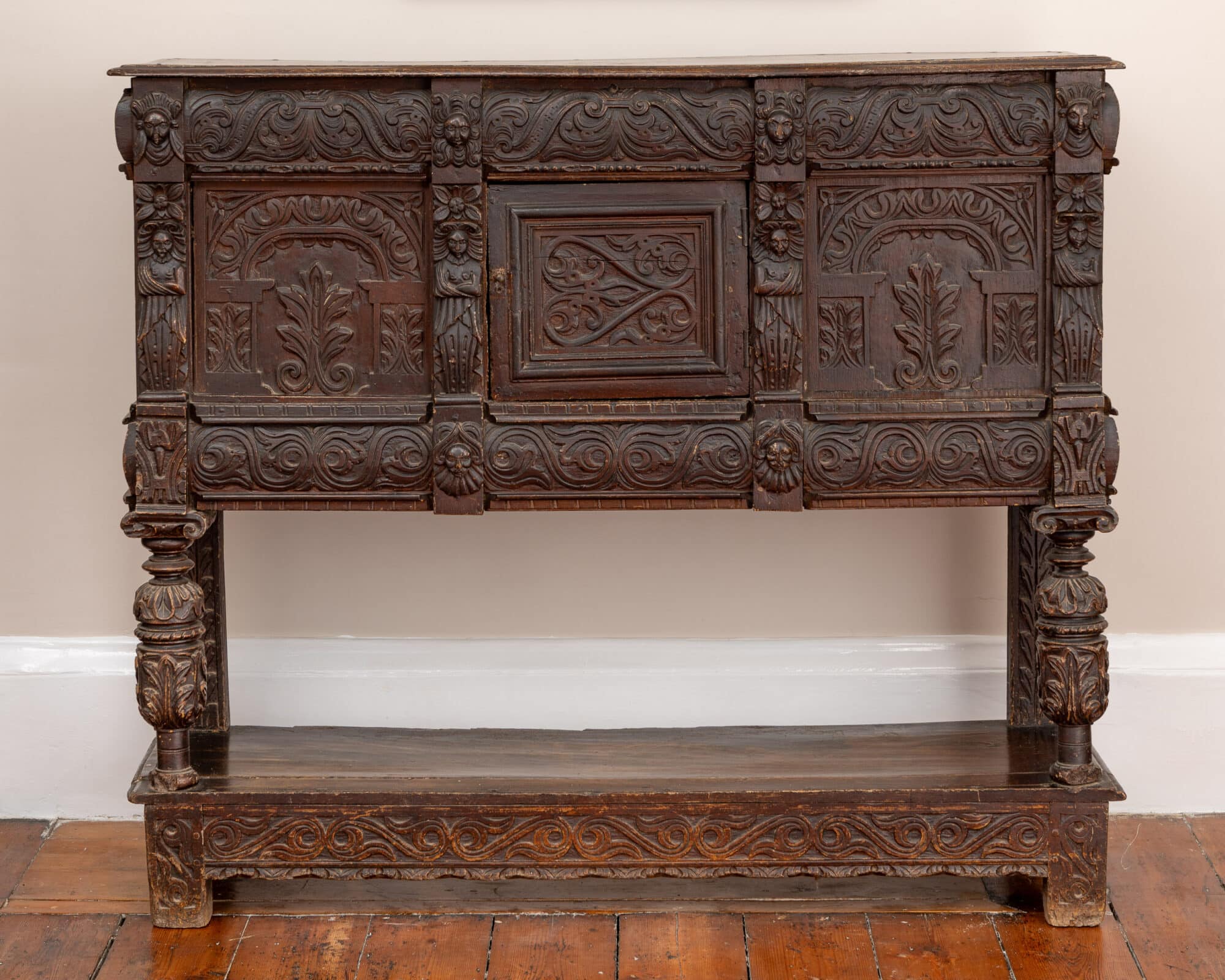 A Late Elizabeth I Carved Oak Cupboard