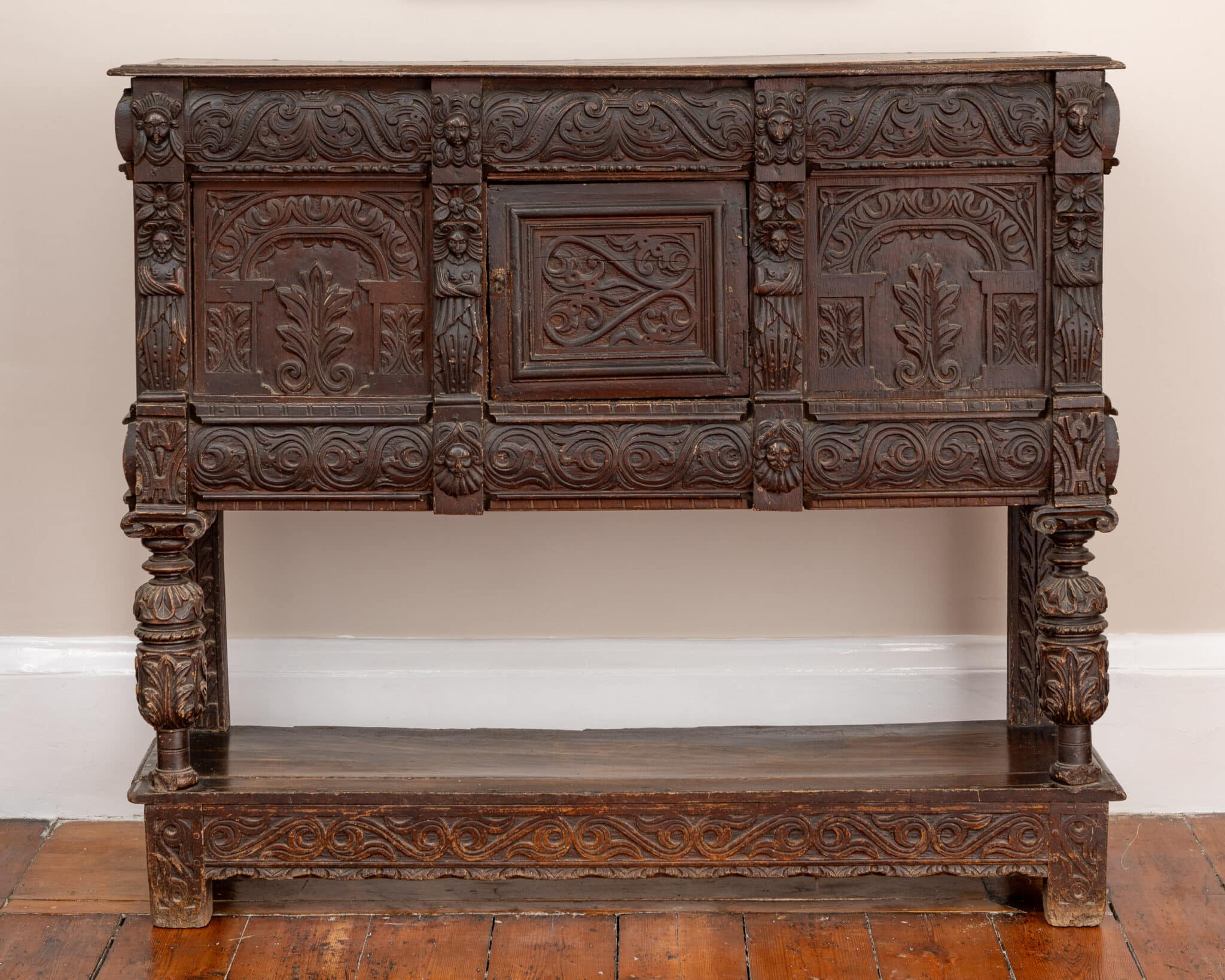 A Late Elizabeth I Carved Oak Cupboard