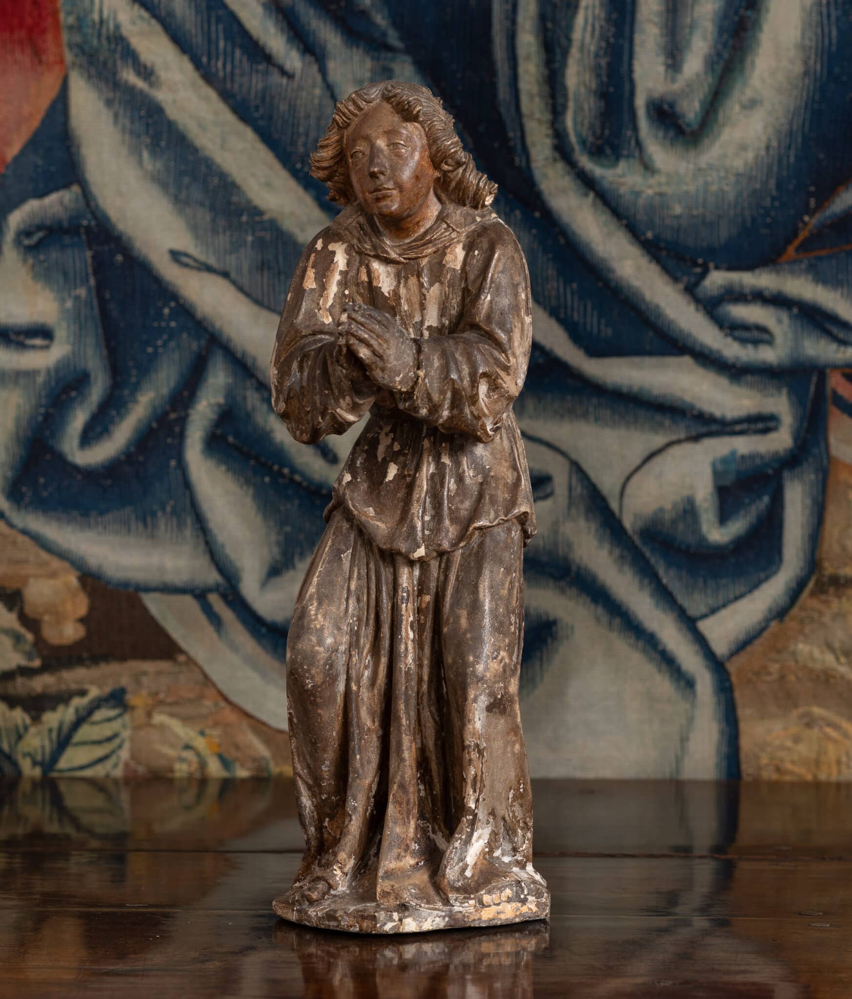 A Late Gothic Limestone Figure of a Praying Angel