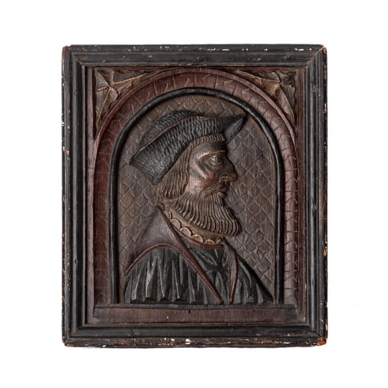 Henry VIII period carved oak portrait panel of a bearded man