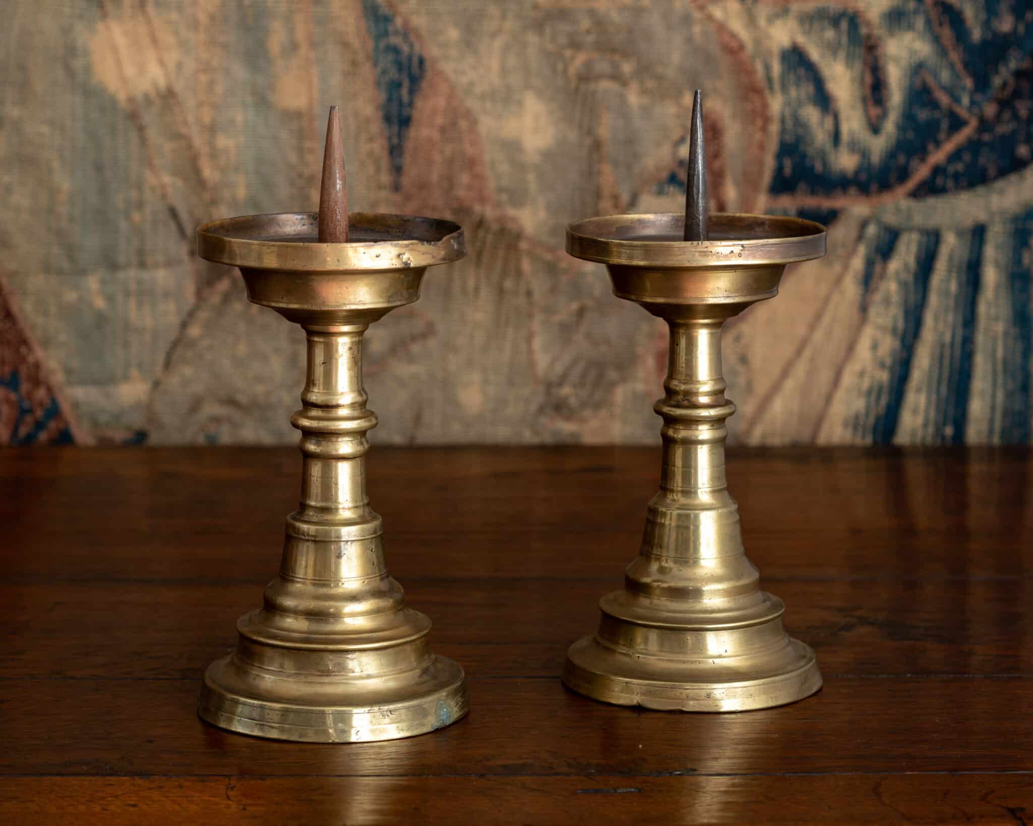 A Pair of Late Gothic Brass Pricket Candlesticks