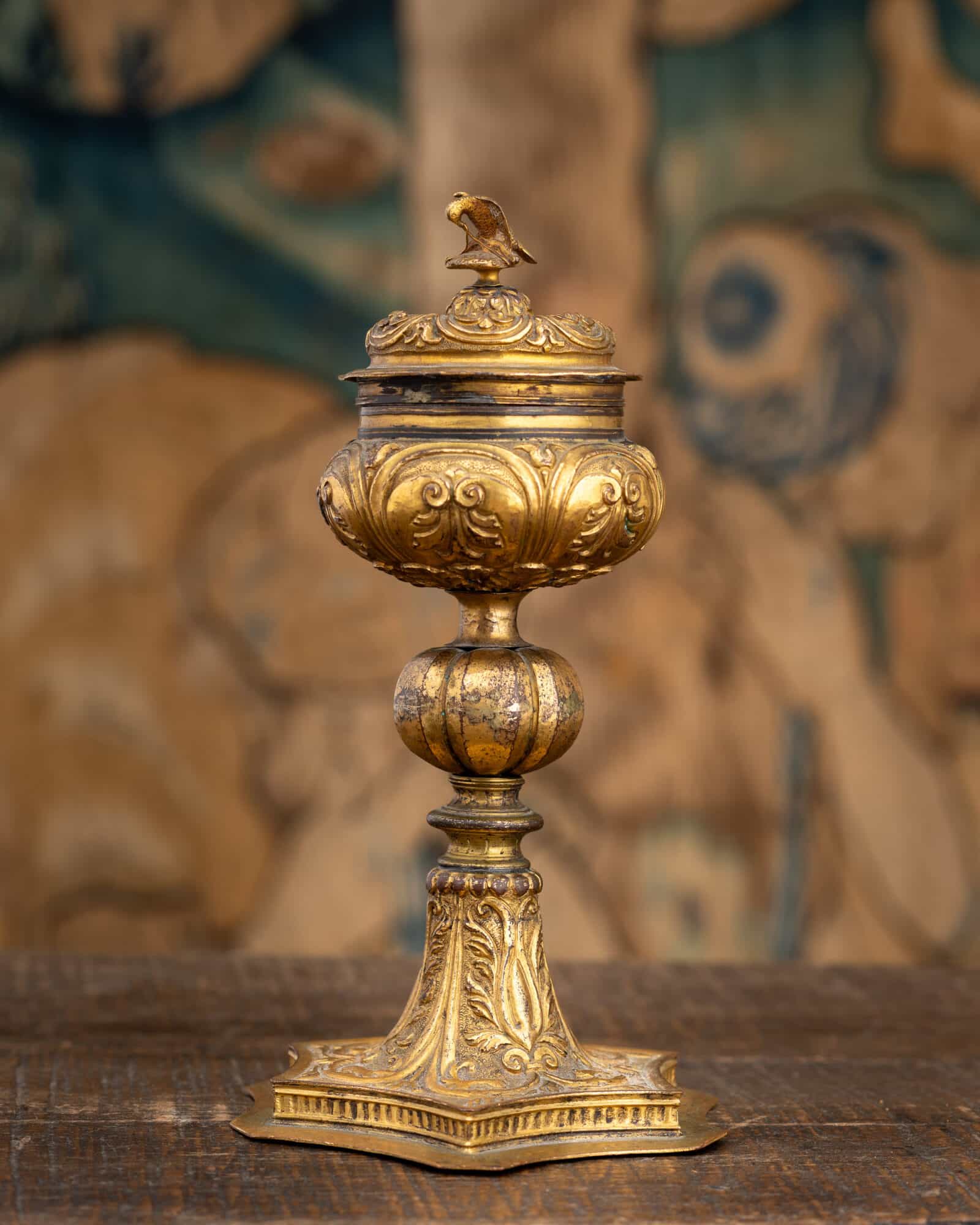 A Late Renaissance Copper-Gilt Covered Standing Salt with a Falcon Overcoming a Serpent