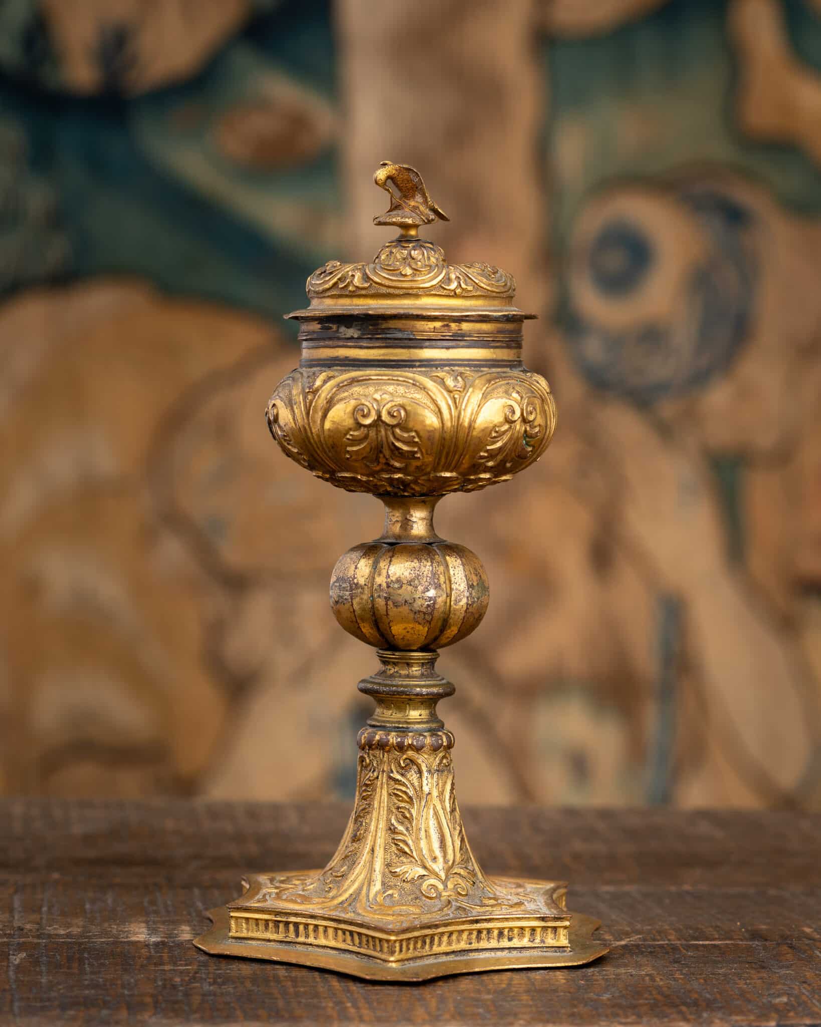 A Late Renaissance Copper-Gilt Covered Standing Salt with a Falcon Overcoming a Serpent