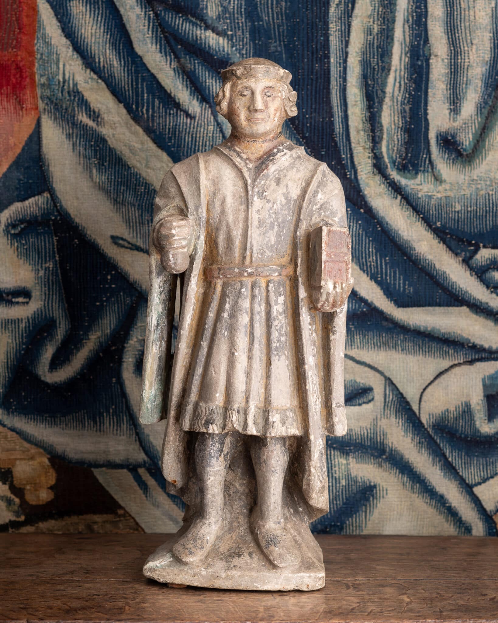 A Late Gothic Polychromed Limestone Figure of a Gentleman or Civic Dignitary